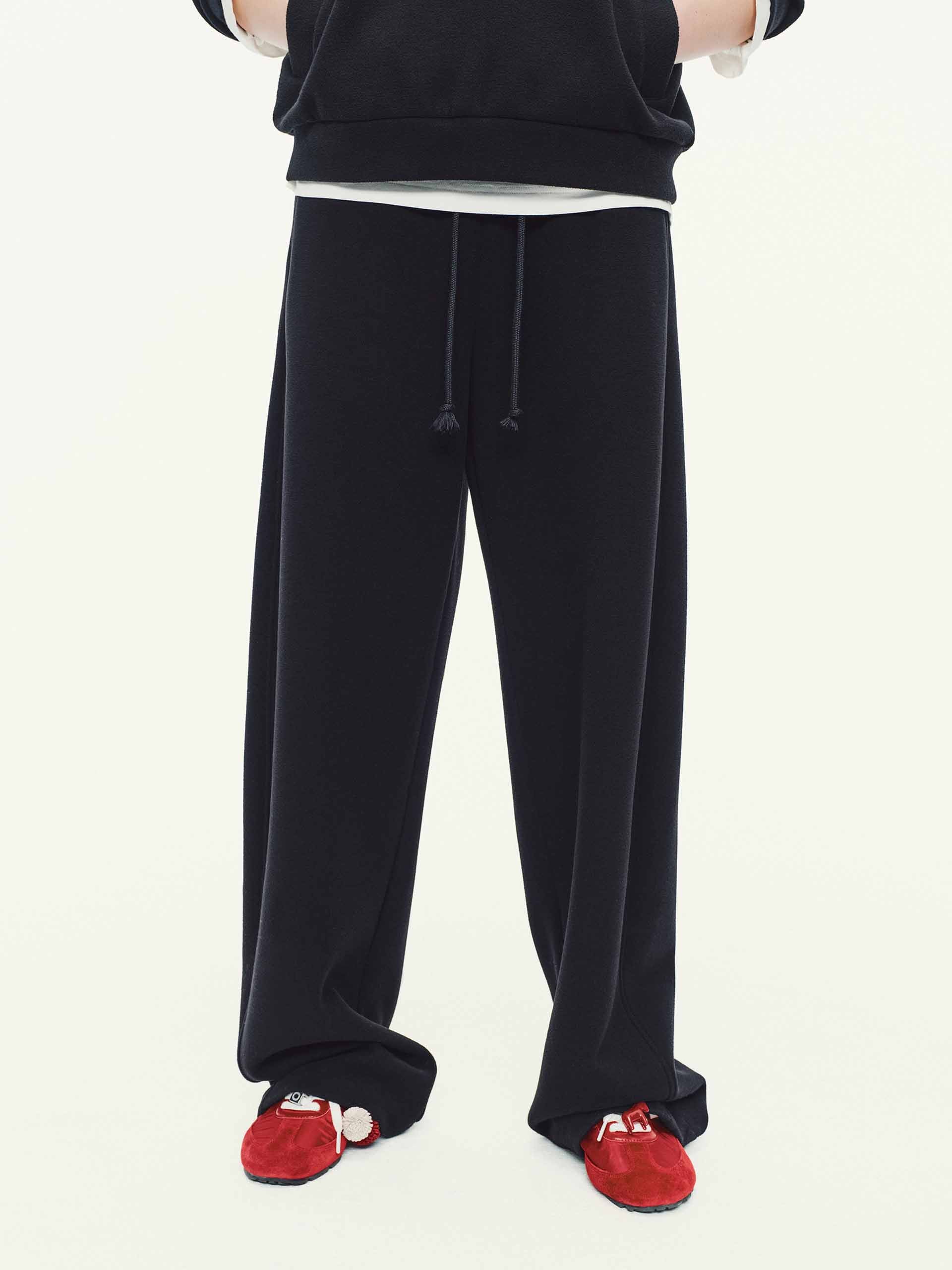 MO&Co. Drawstring Barrel Pants with Asymmetrical Seams in Black