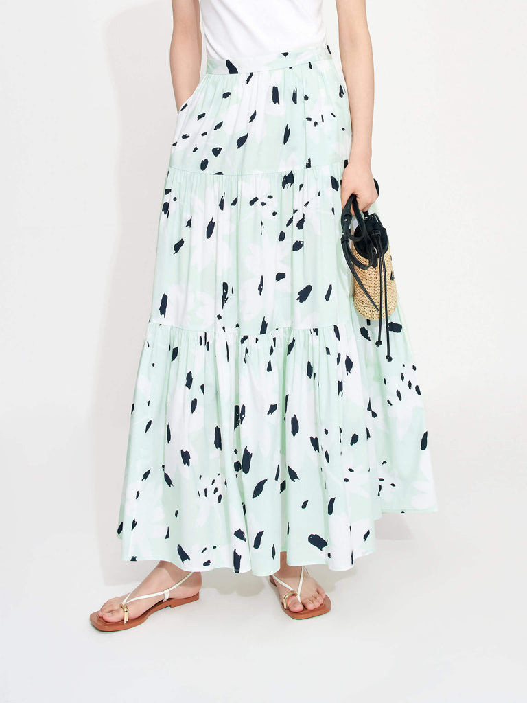 MO&Co. Women's Tiered Floral Print Maxi Skirt in Mint features a flowy fit, high waist and pleated design. Plus, the bold floral print and side zipper closure create a standout style.