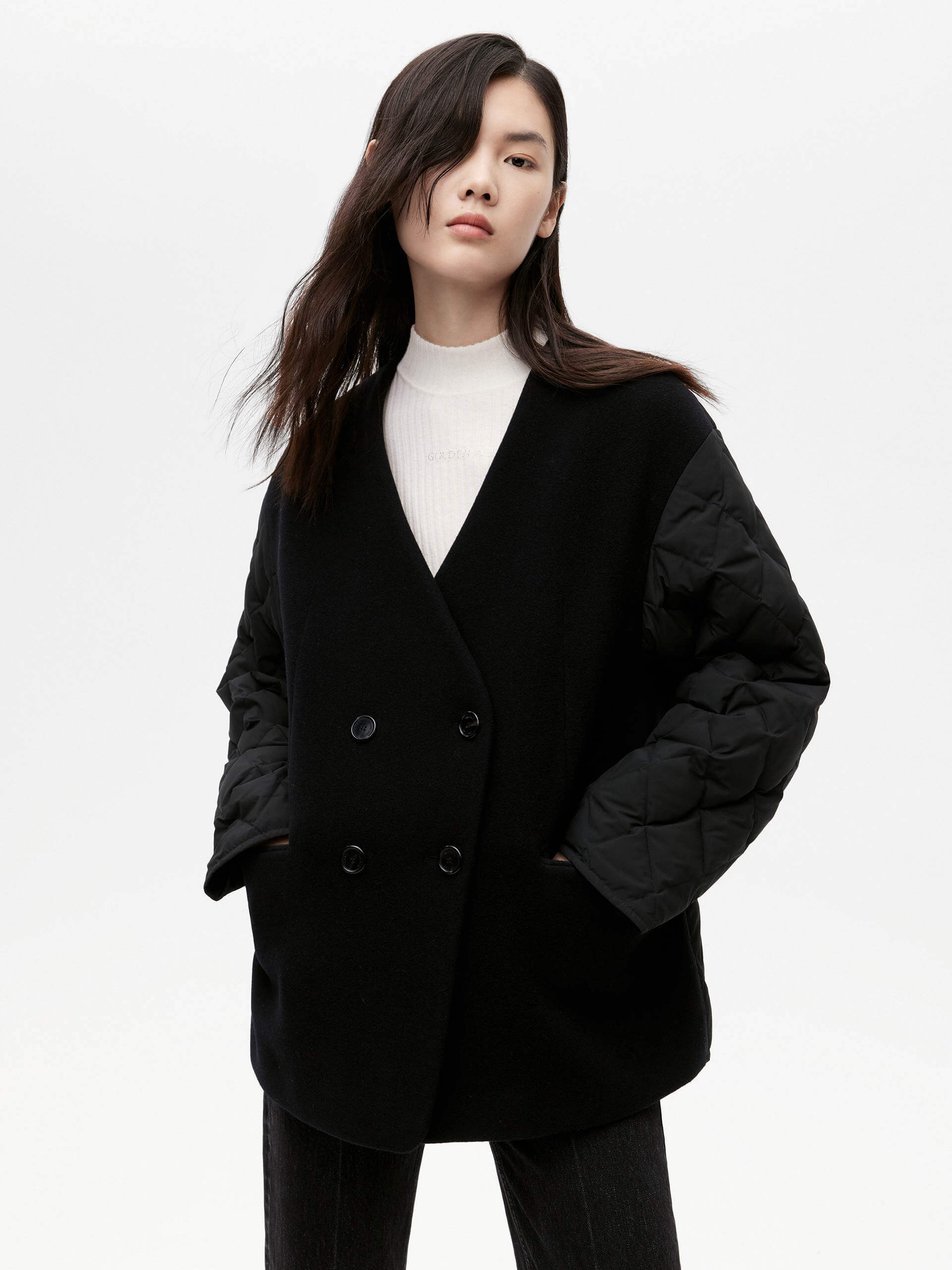 MO&Co. Women's V-neck Quilted Shell Wool Blend Jacket in Black, featuring a button closure and flap pocket design. Wool panel front , quilted shell sleeves and back add a unique touch and extra warmth.