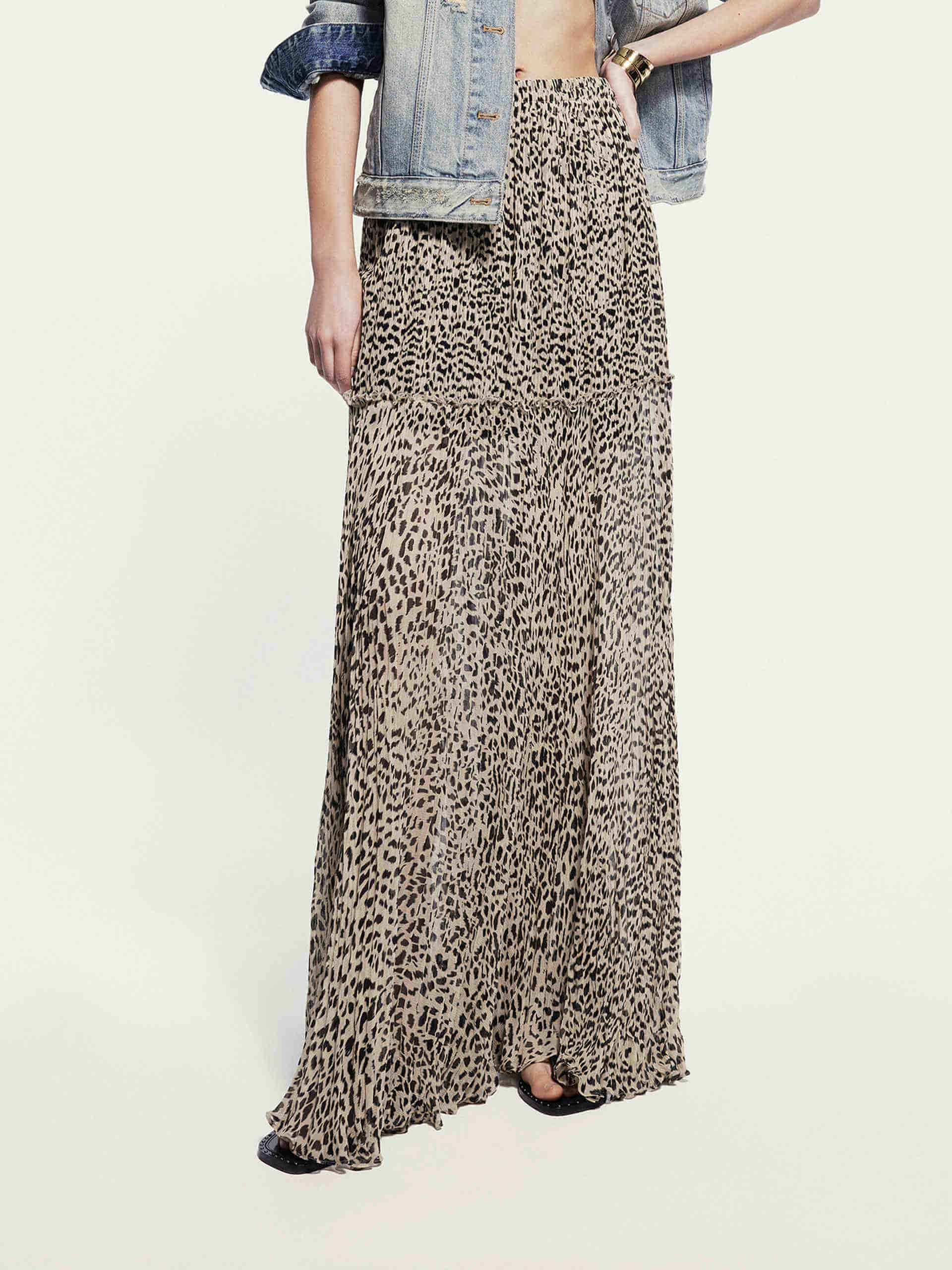 MO&Co. Noir Women's Maxi Leopard Print Skirt. Crafted from 100% silk with ruched pleated details, this skirt exudes luxury and style.
