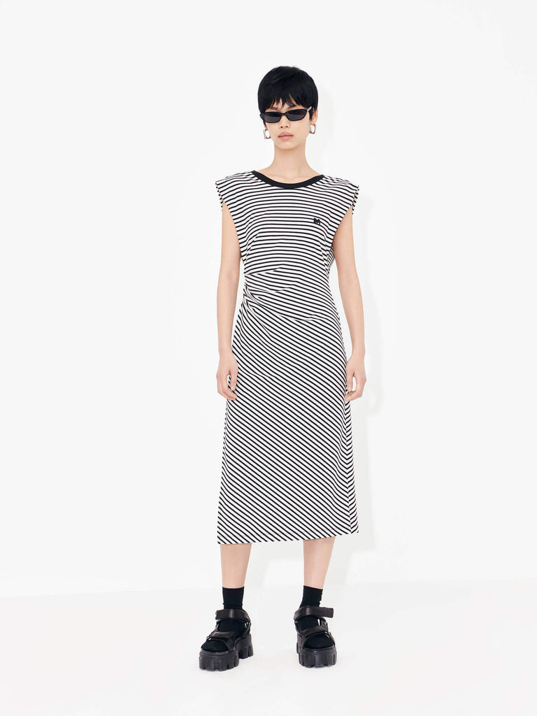 Be effortlessly elegant in this MO&Co. Gathered Waist Stripe dress in Classic Black and White. It features a timeless black and white striped pattern, a pleated gathering at the waist, a cross design at the back, and wide shoulders for a flattering silhouette.