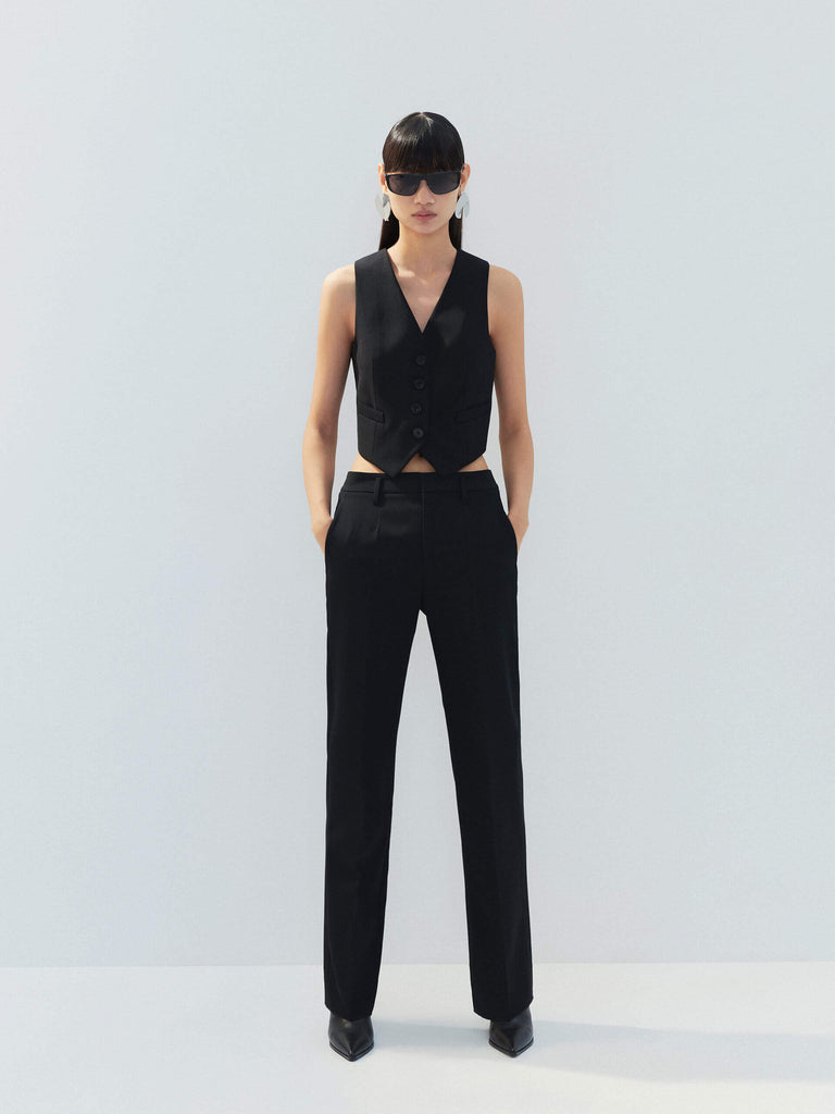 MO&Co. Noir Women's Tailored Straight Black Wool Suit Pants. The straight legs, full length design, hook-and-bar closure, and slanted pockets add to the tailored appeal of these versatile pants.