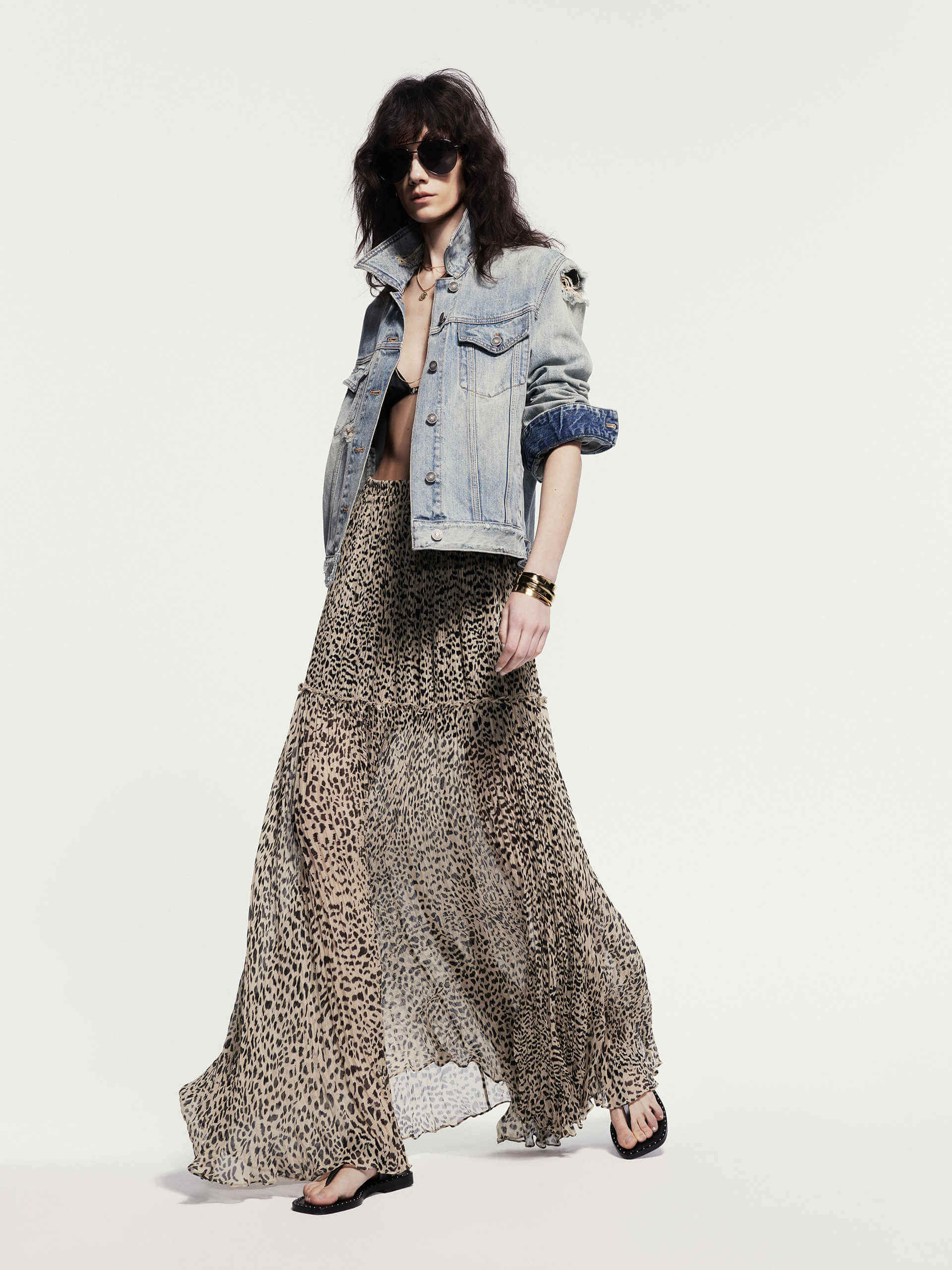 MO&Co. Noir Women's Maxi Leopard Print Skirt. Crafted from 100% silk with ruched pleated details, this skirt exudes luxury and style.