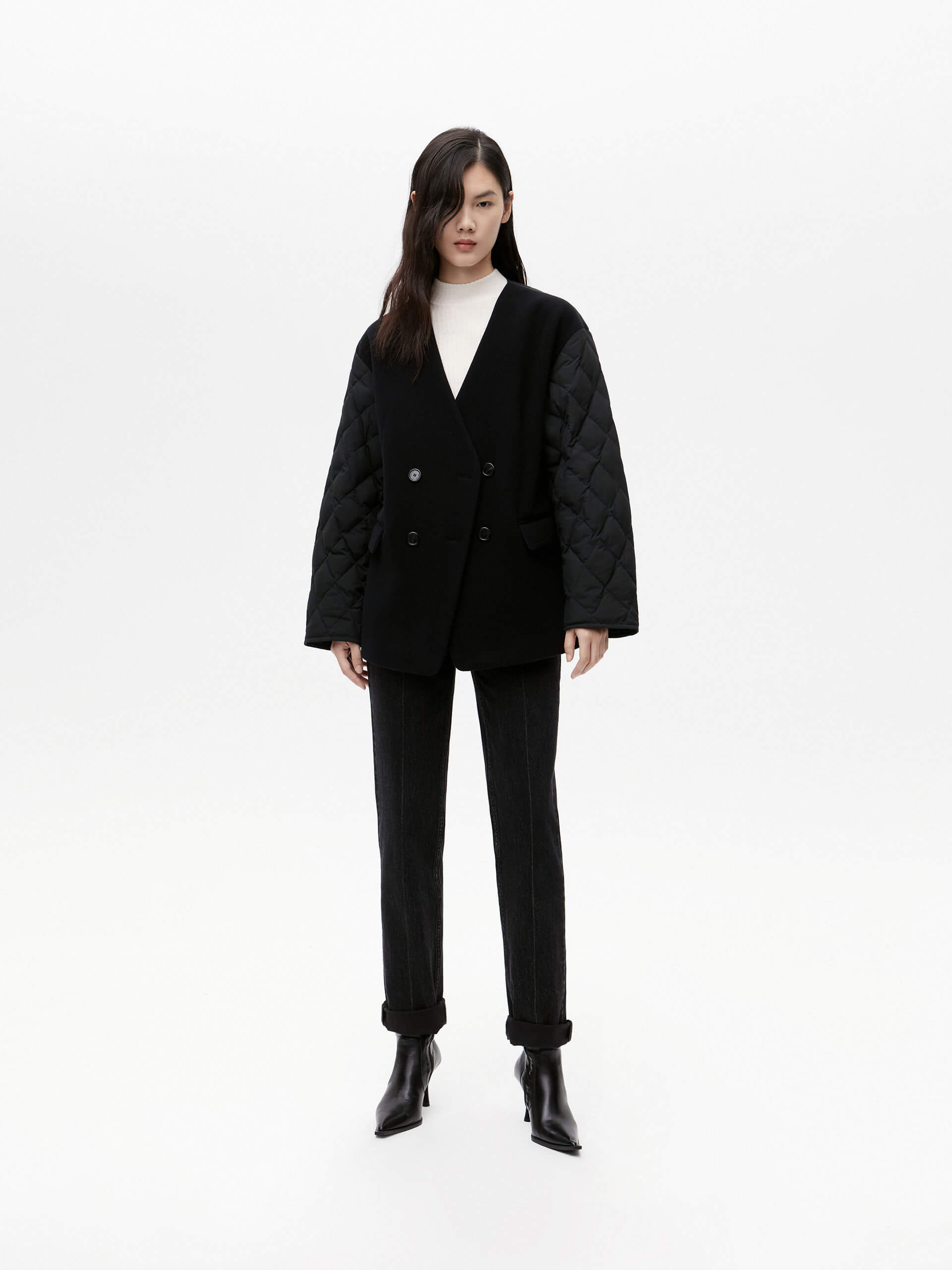 MO&Co. Women's V-neck Quilted Shell Wool Blend Jacket in Black, featuring a button closure and flap pocket design. Wool panel front , quilted shell sleeves and back add a unique touch and extra warmth.