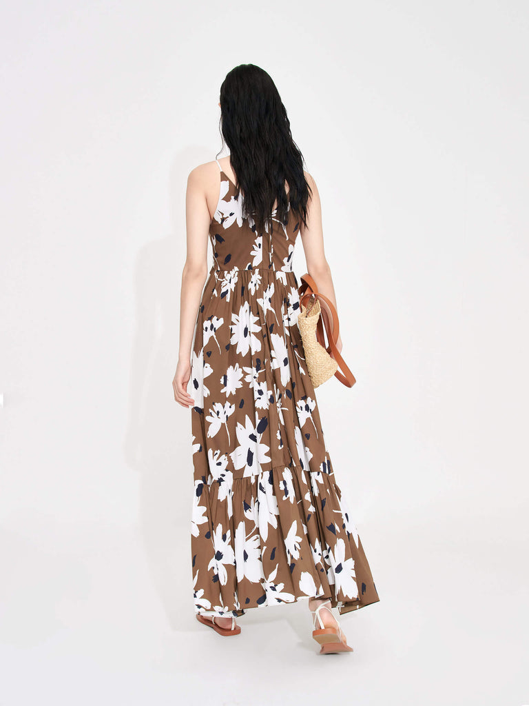 MO&Co. Women's Tropical Floral Print Vacation Maxi Dress in Brown features a V-neck, pleated details, cascading skirt and halterneck tie.