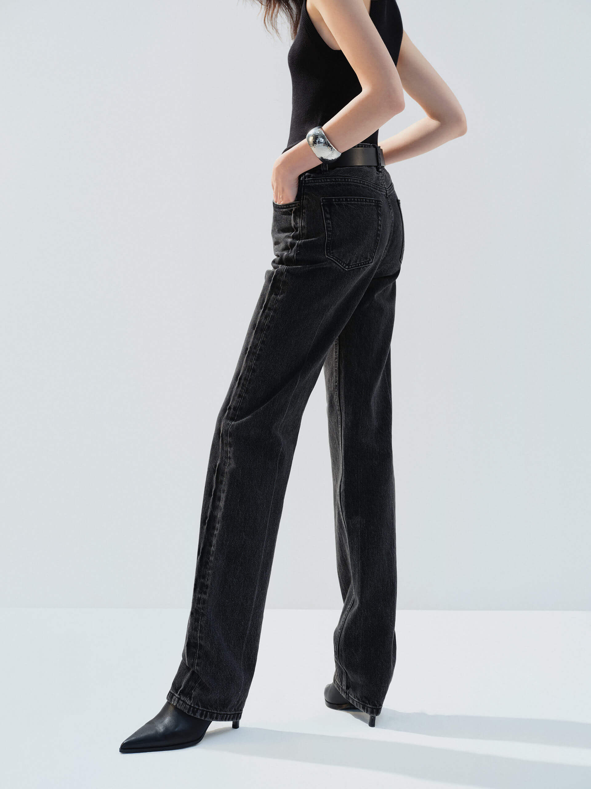 MO&Co. Noir Women's High Waist Black Straight Jeans Cotton features a regular fit, straight leg, and full length, these jeans also offer a button fly, five-pocket design, and a chic side-washed faded effect.