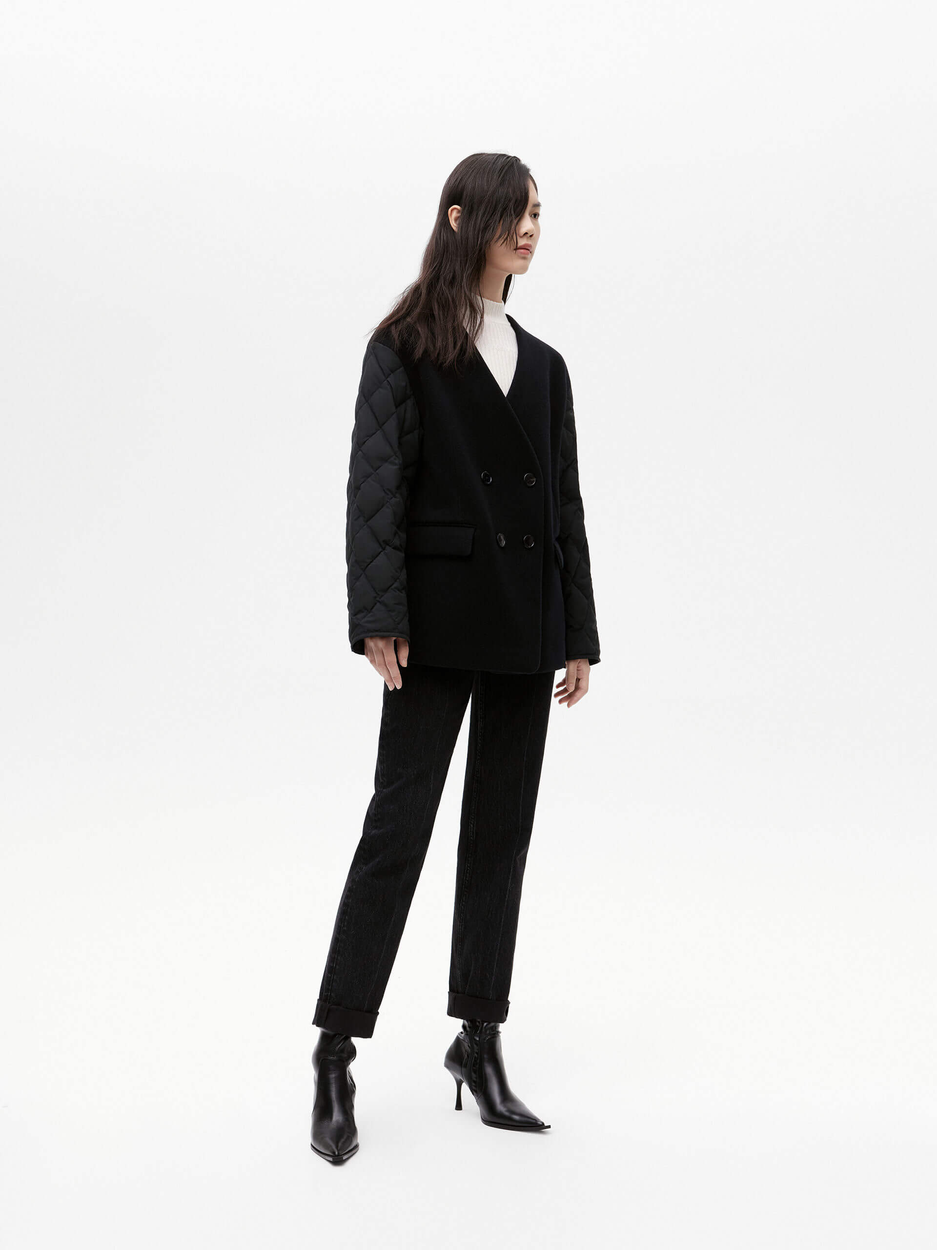 MO&Co. Women's V-neck Quilted Shell Wool Blend Jacket in Black, featuring a button closure and flap pocket design. Wool panel front , quilted shell sleeves and back add a unique touch and extra warmth.