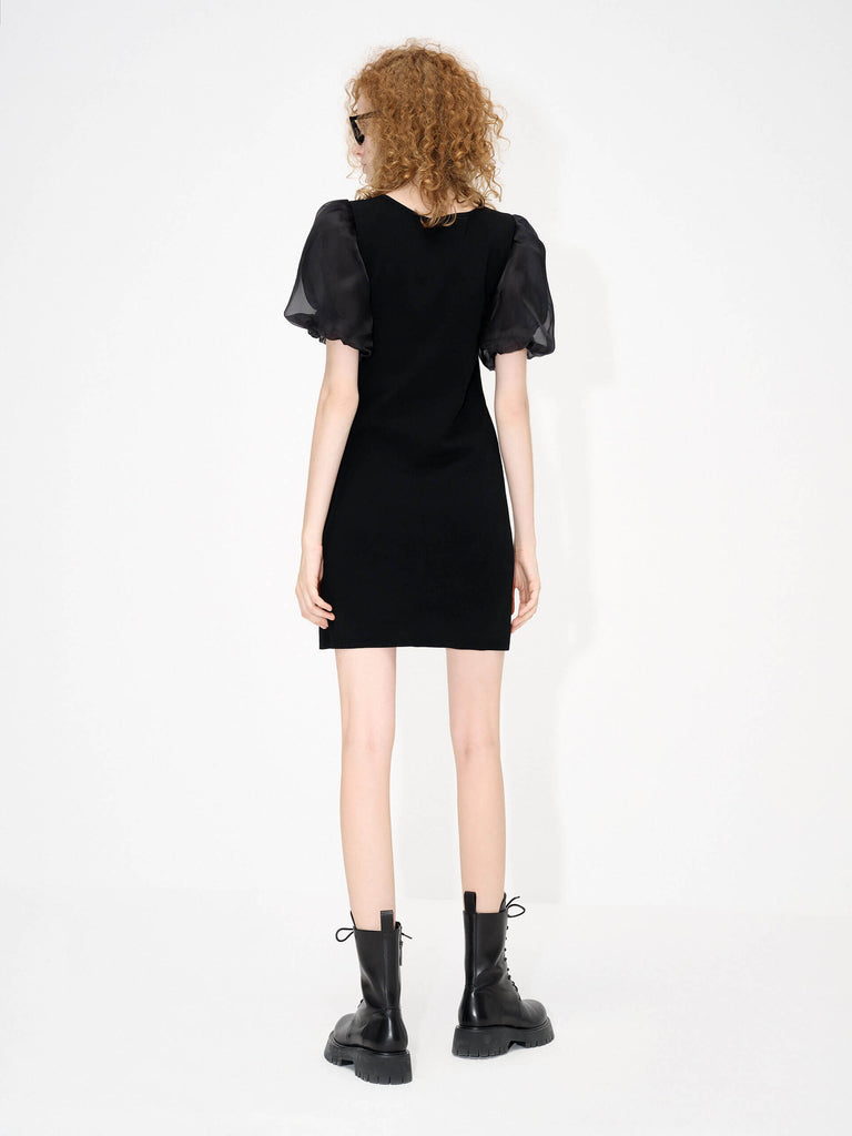 MO&Co. Women's Asymmetric Collar Mini Dress in Black featured with sheer puff sleeves and ssymmetric collar with metallic buckle details