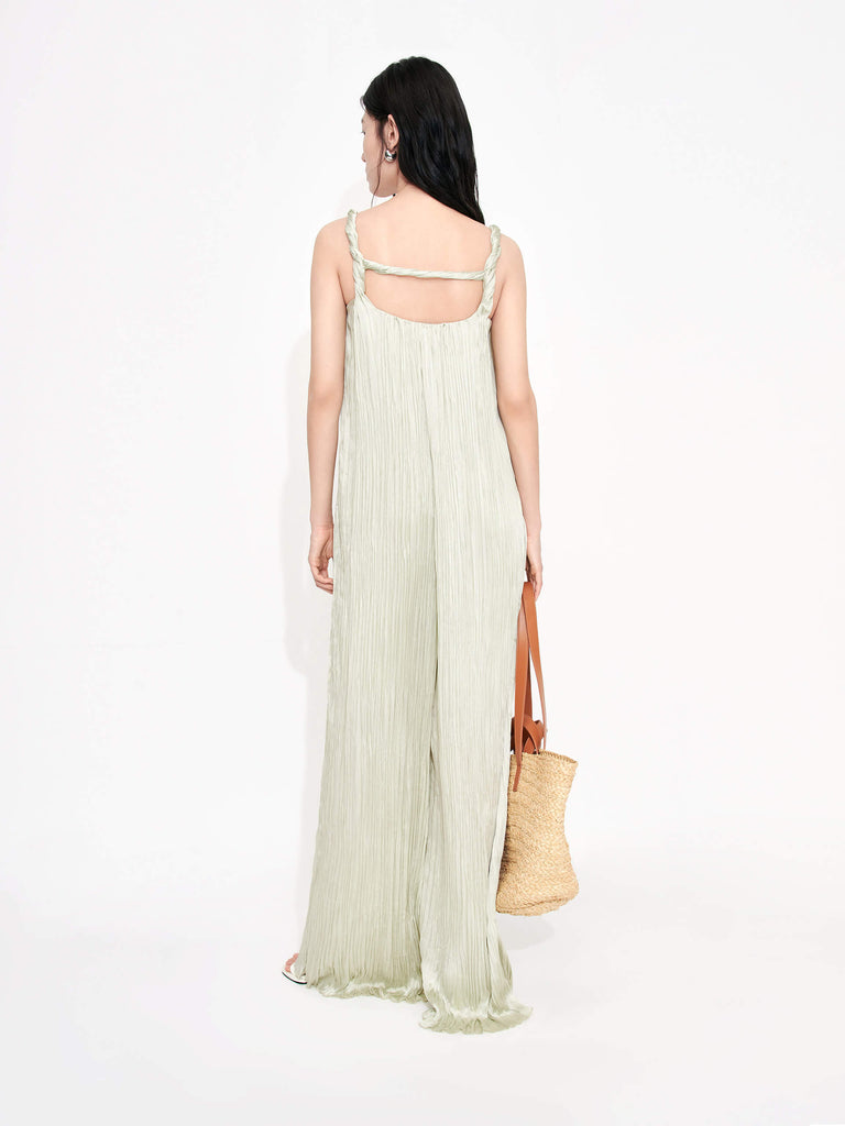 MO&Co. Women's Textured Wide Leg Jumpsuit in Mint features an included belt & double side pocket design. Its elegantly draped & twisted shoulder strap completes the look for a timeless classic.