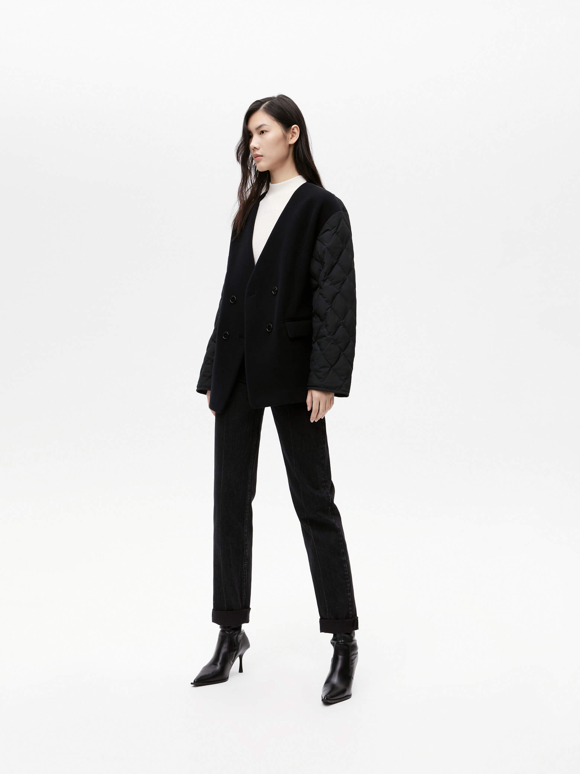 MO&Co. Women's V-neck Quilted Shell Wool Blend Jacket in Black, featuring a button closure and flap pocket design. Wool panel front , quilted shell sleeves and back add a unique touch and extra warmth.