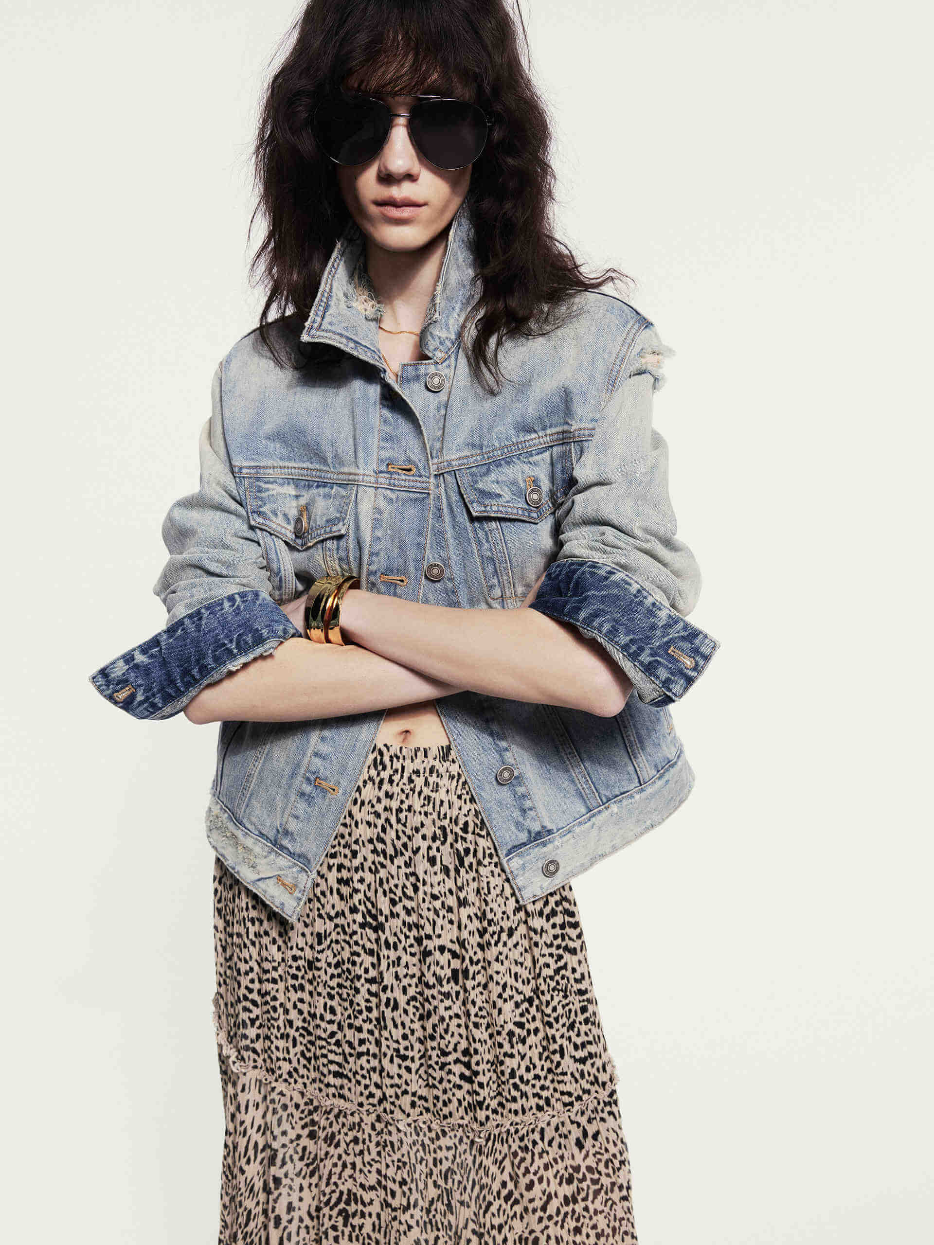 MO&Co. Noir Women's Maxi Leopard Print Skirt. Crafted from 100% silk with ruched pleated details, this skirt exudes luxury and style.