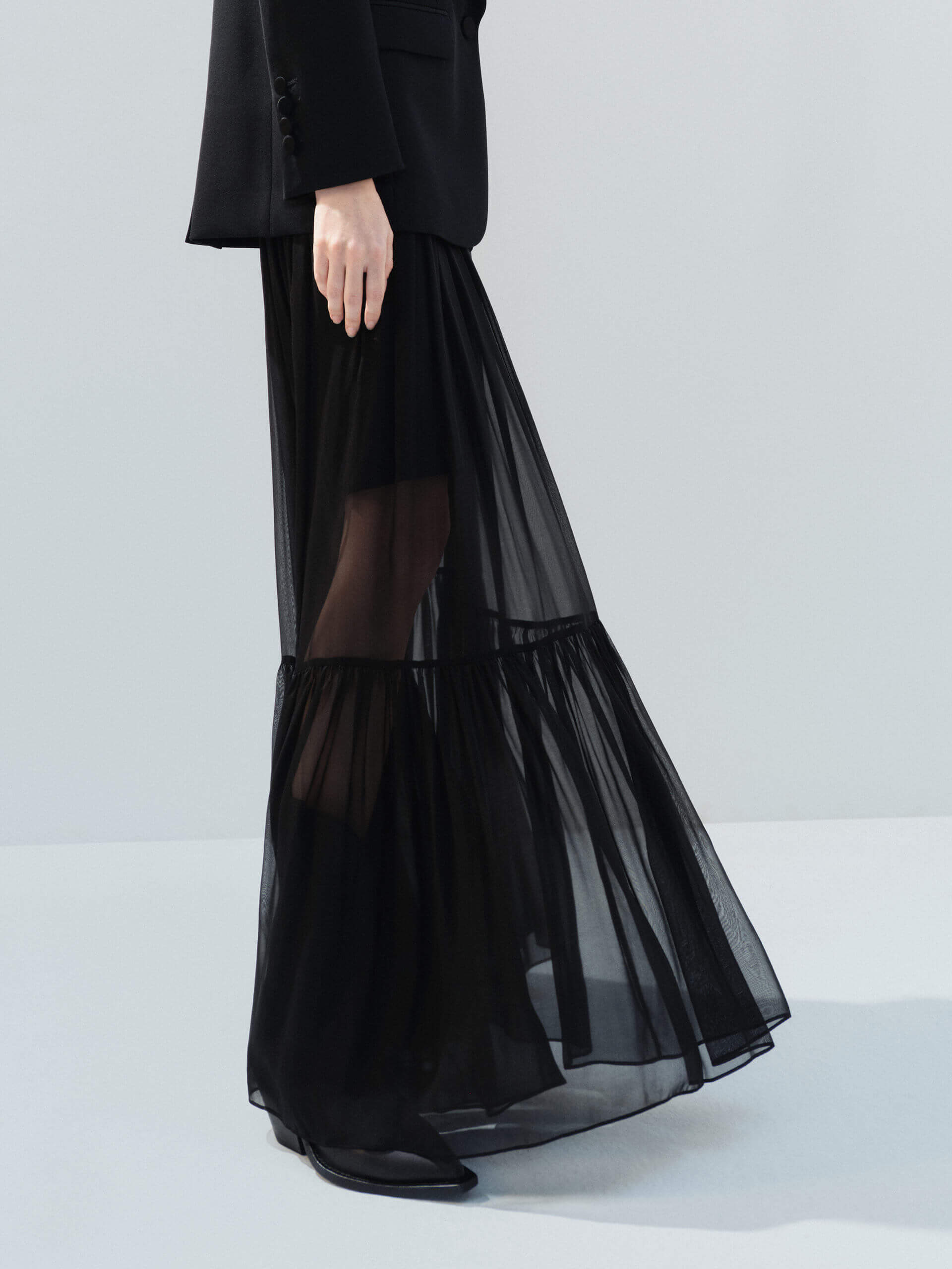 MO&Co. Noir Women's Elasticated Waist Black Silk Maxi A-line Skirt. Crafted from soft silk, this skirt boasts a flattering maxi cut with distinct pleats and gathers that add texture and movement to your look.