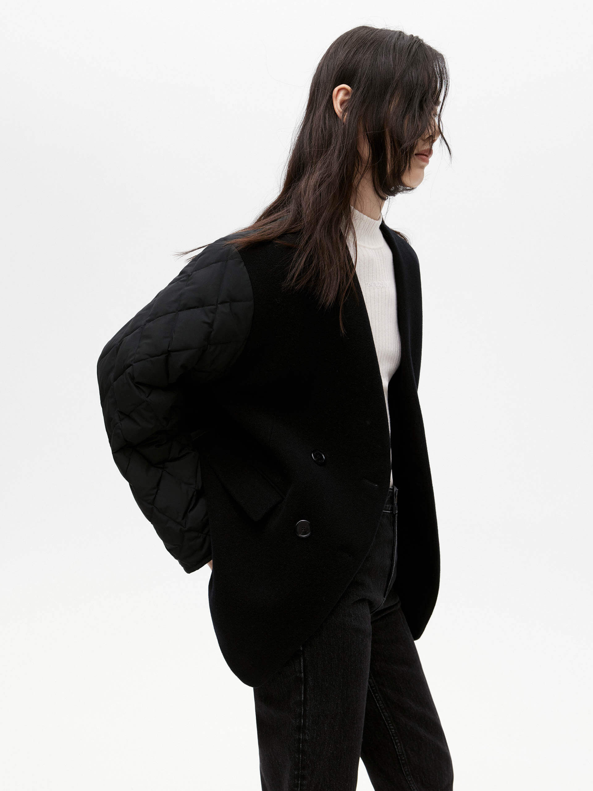 MO&Co. Women's V-neck Quilted Shell Wool Blend Jacket in Black, featuring a button closure and flap pocket design. Wool panel front , quilted shell sleeves and back add a unique touch and extra warmth.