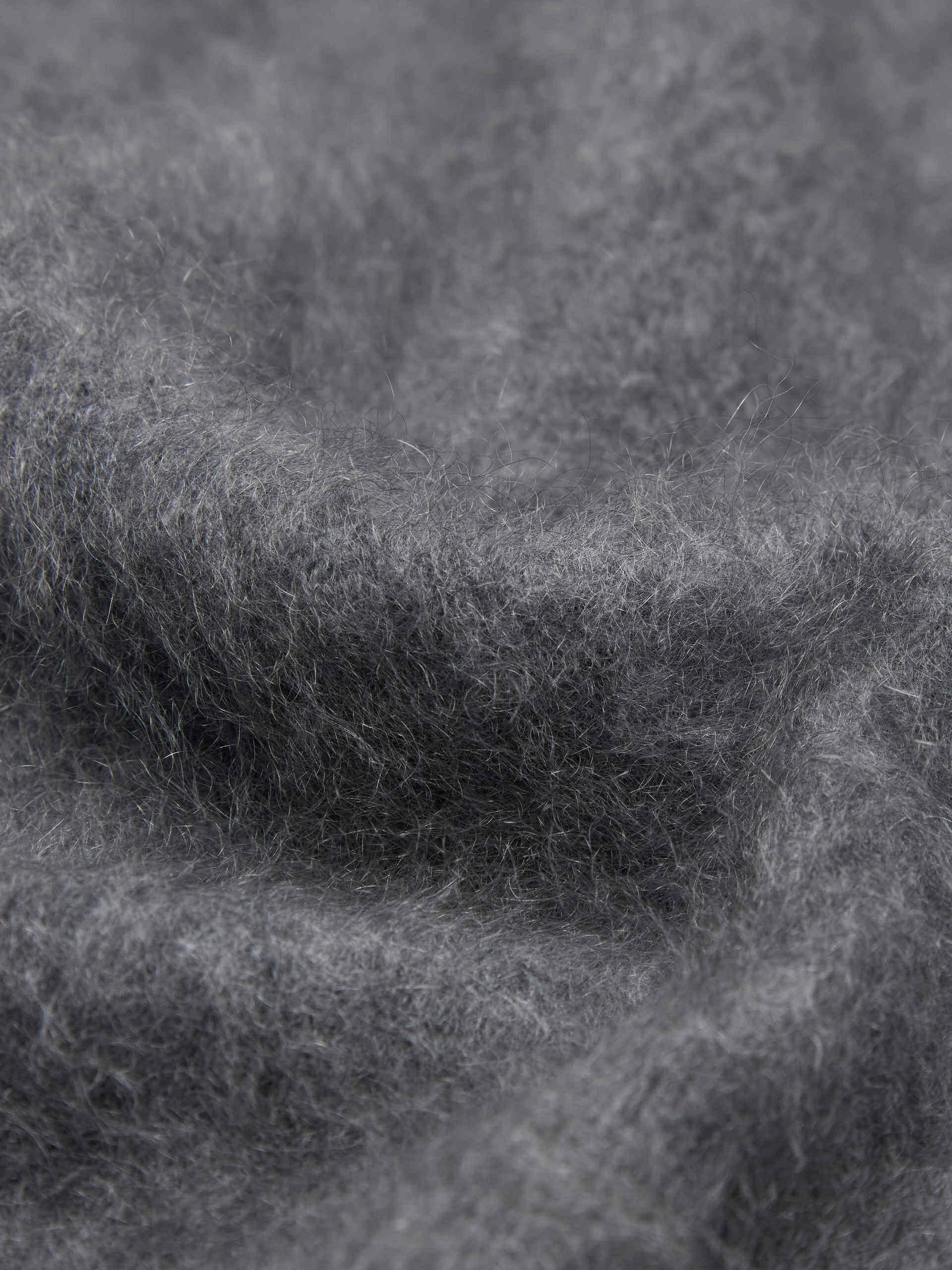 MO&Co. Noir Women's V-Neck Cashmere Cardigan Grey with a relaxed fit, deep V-neck design, and ribbed trims on the waist and cuffs.