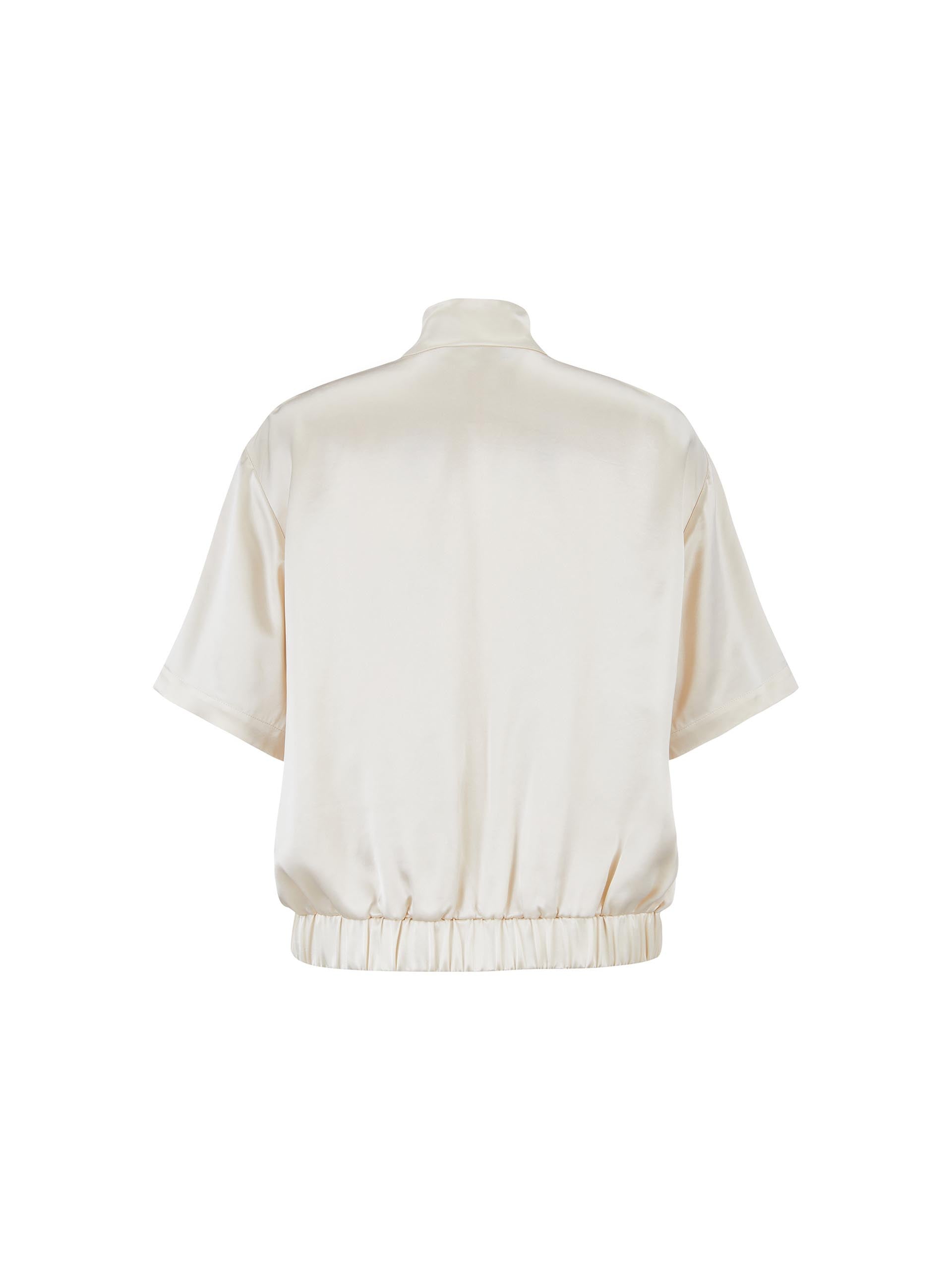 MO&Co. Women's Satin Acetate Blend Casual Track Jacket in Short Sleeves in Beige. Features: Loose fit, contrasting trim design, elasticized hem, side pockets & zip closure, and an acetate blend fabric for softness & comfort.