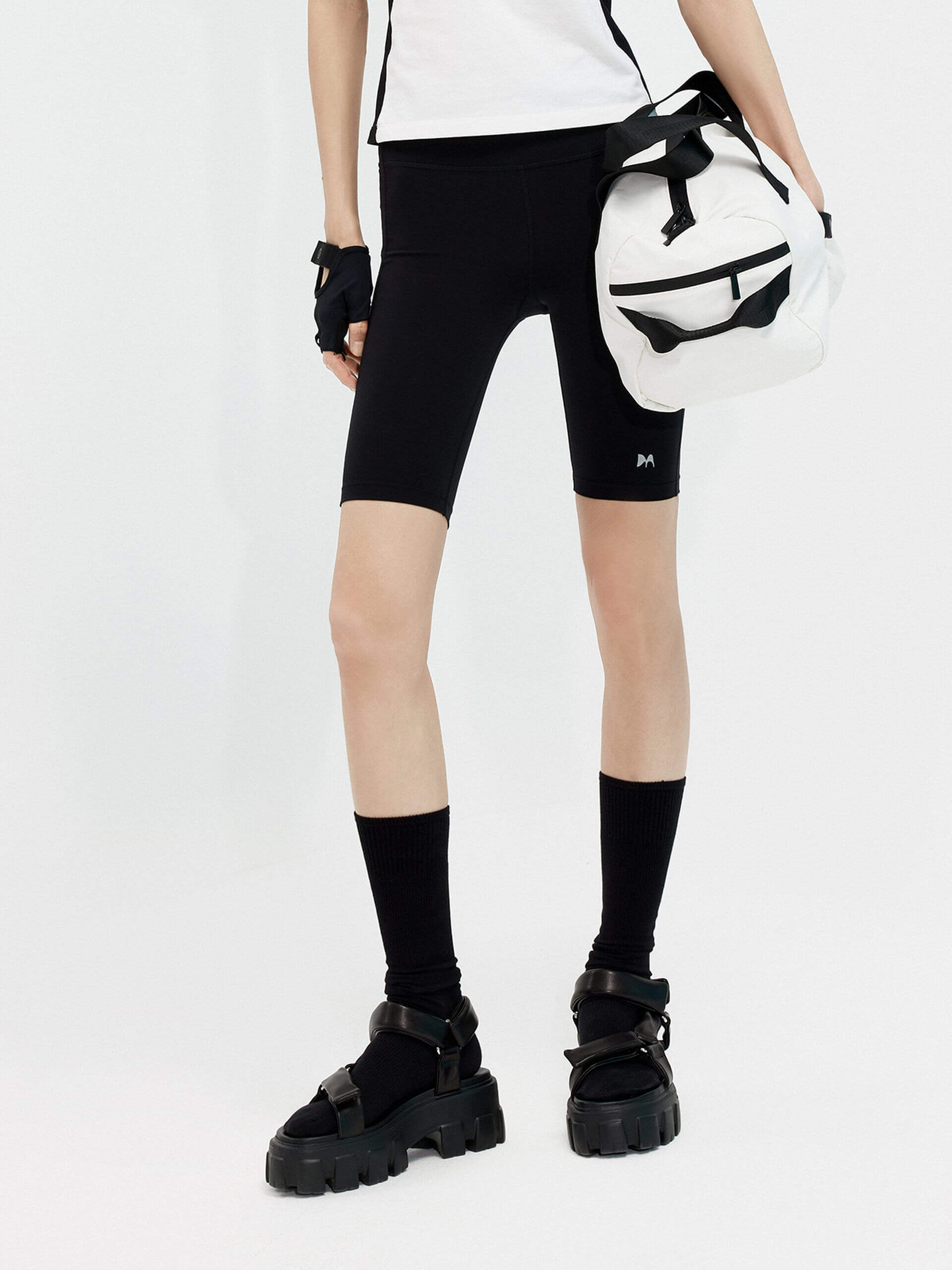 Try MO&Co.'s High Waist Sports Shorts in Black for women! These biker shorts hug your shape, thanks to stretchy material that moves with you. Plus, they feature a high rise with an elasticized waistband.