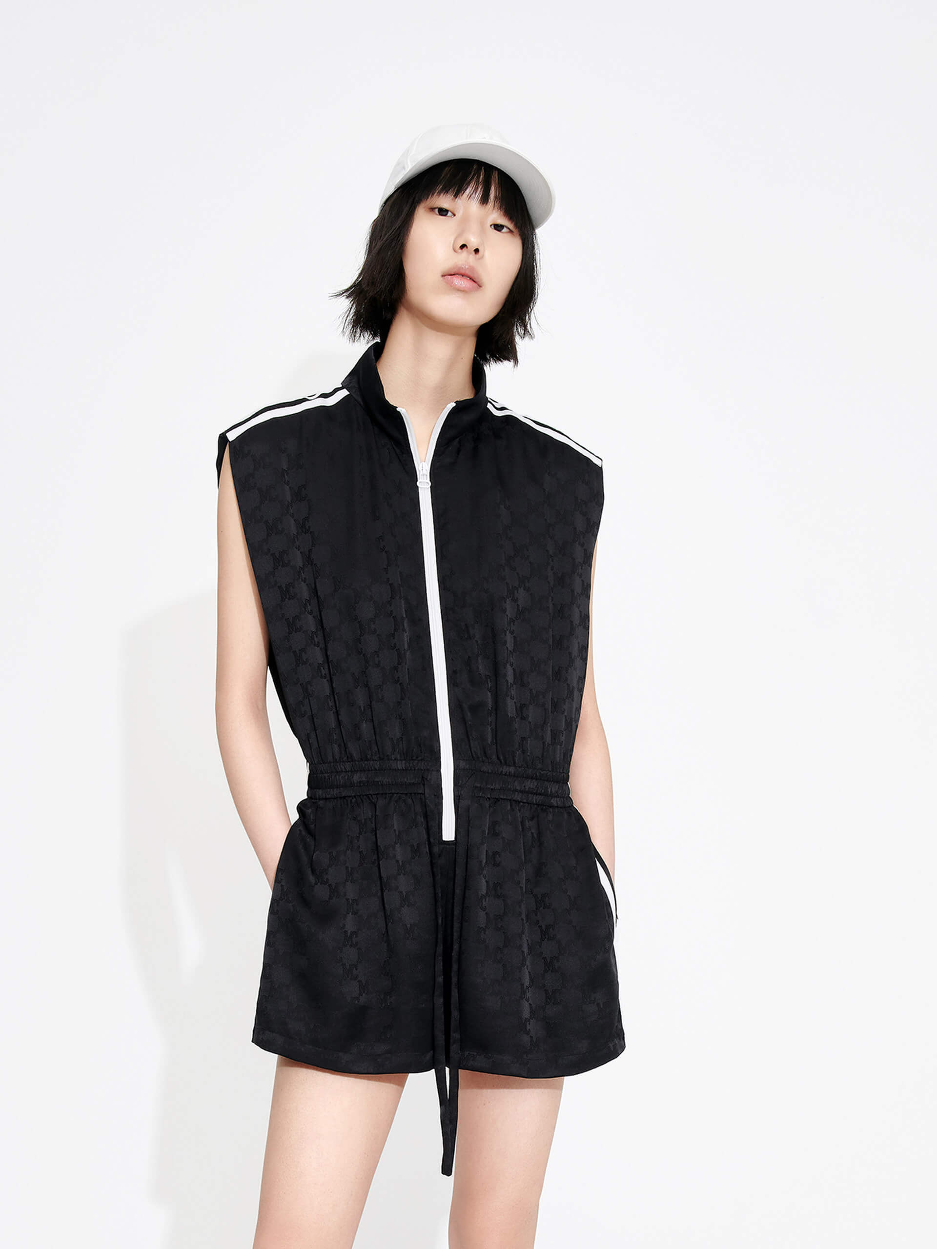 MO&Co. Women's Silk Blend Monogram Jacquard Sleeveless Playsuit in Black with drawstring waistline and a zipper along the front