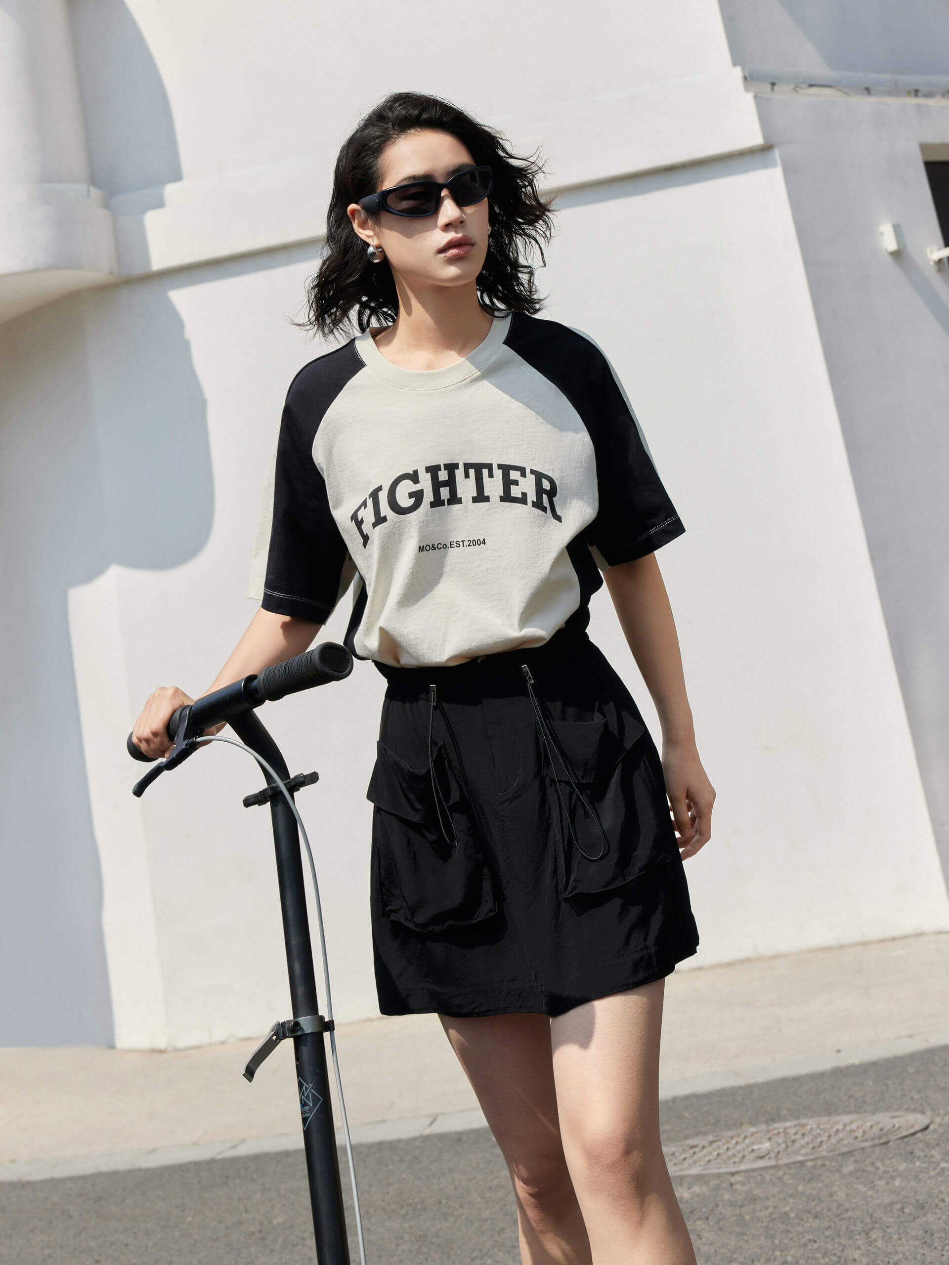 MO&Co. Women's Color Block Letter Print Relaxed Fit Cotton T-shirt in Beige featuring raglan sleeves with color block details, a letter print on the chest, the relaxed fit and crew neckline give you maximum comfort wherever you go.