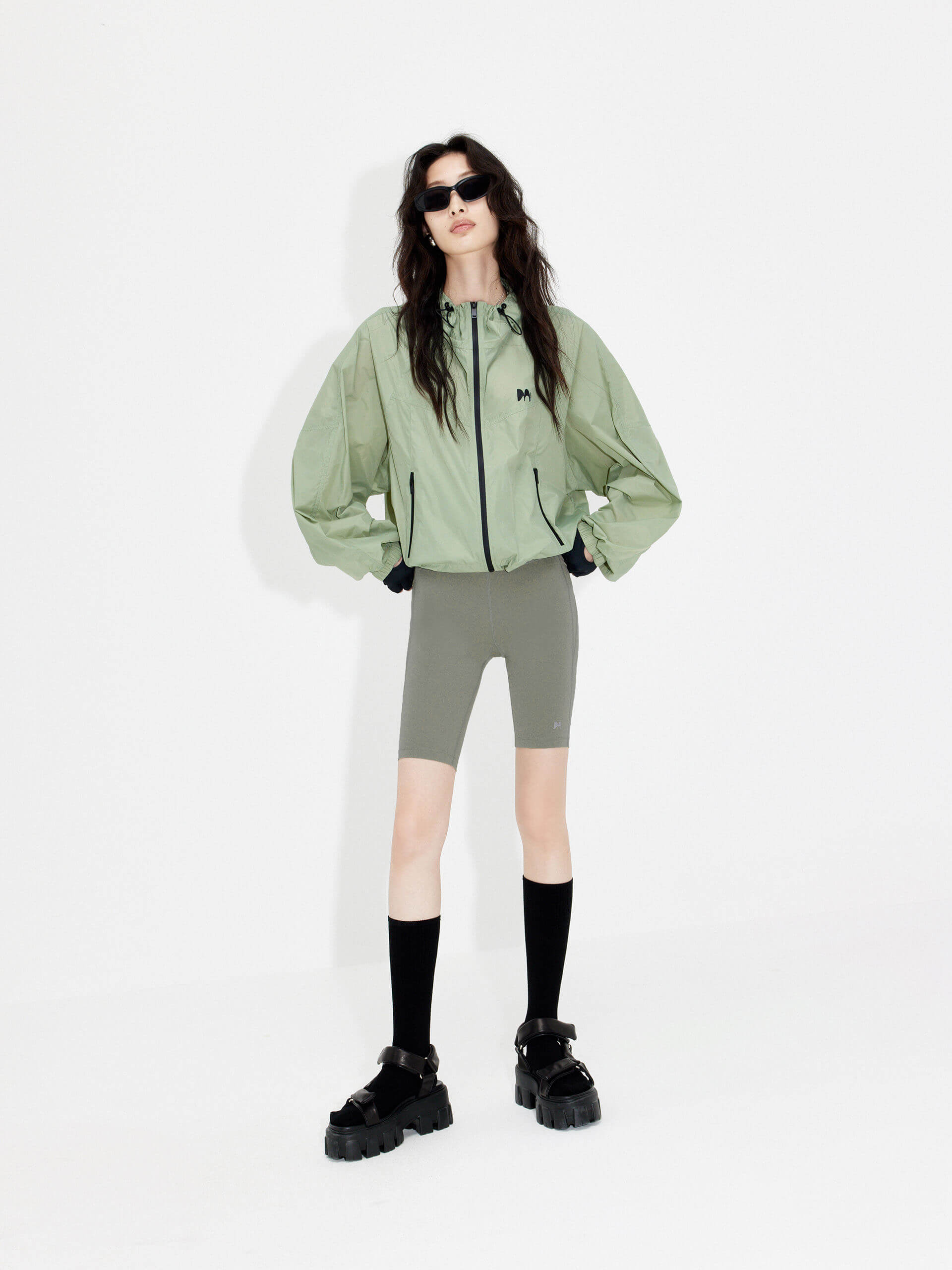 Try MO&Co.'s High Waist Sports Shorts in Olive for women! These biker shorts hug your shape, thanks to stretchy material that moves with you. Plus, they feature a high rise with an elasticized waistband.