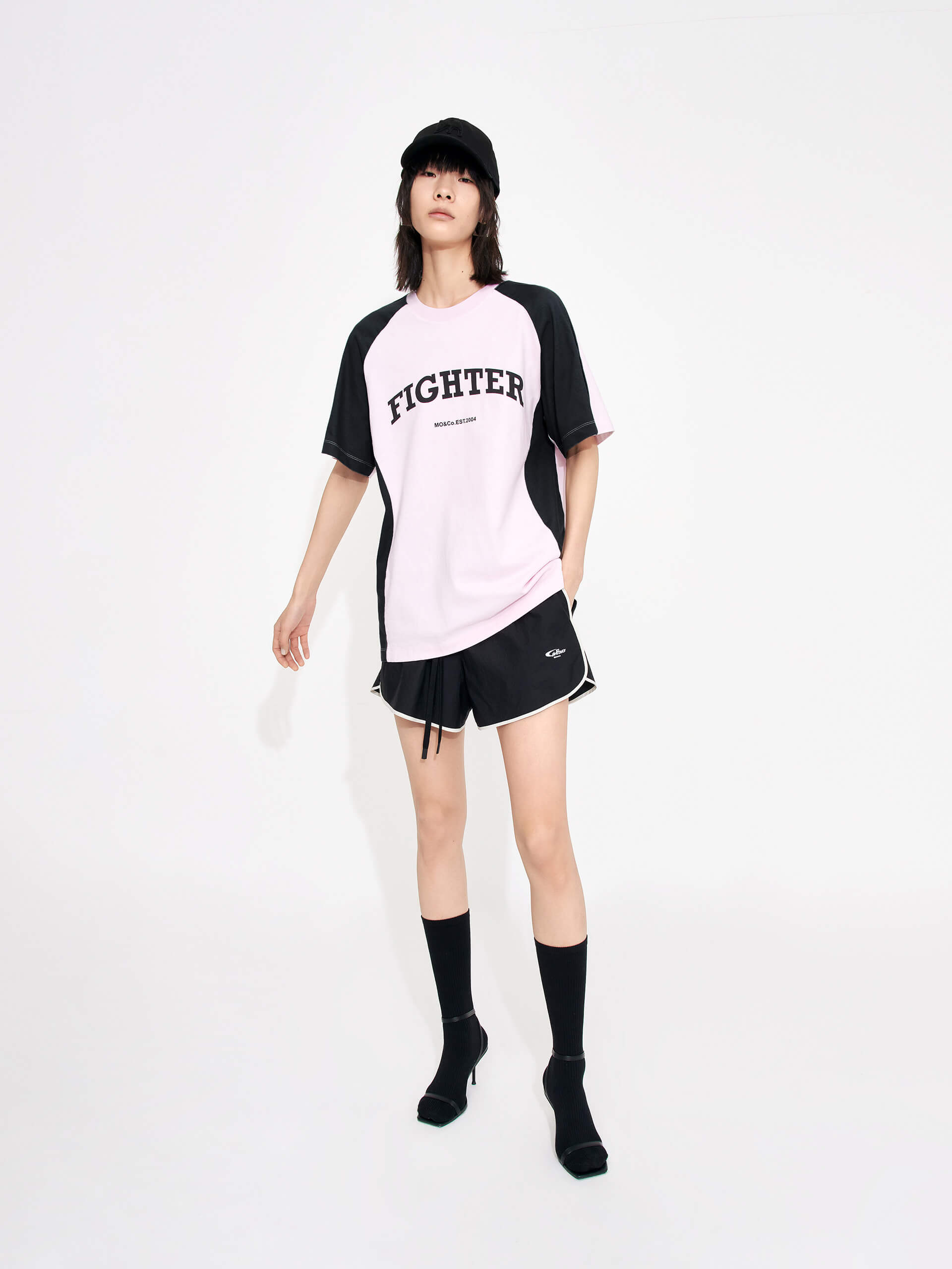 MO&Co. Women's Color Block Letter Print Relaxed Fit Cotton T-shirt in Pink featuring raglan sleeves with color block details, a letter print on the chest, the relaxed fit and crew neckline give you maximum comfort wherever you go.