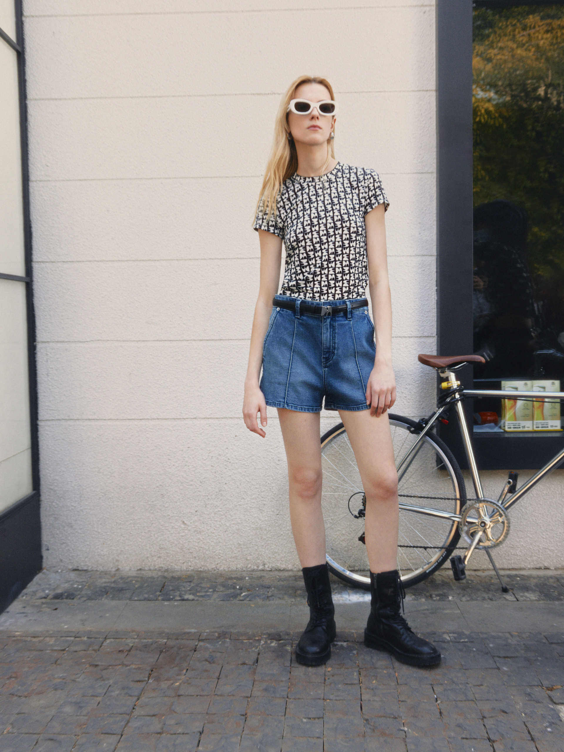 MO&Co. Women's Monogram Print T-shirt is crafted with lightweight, quick-drying and moisture-wicking polyester fabric for breathable comfort and unrestricted movement.