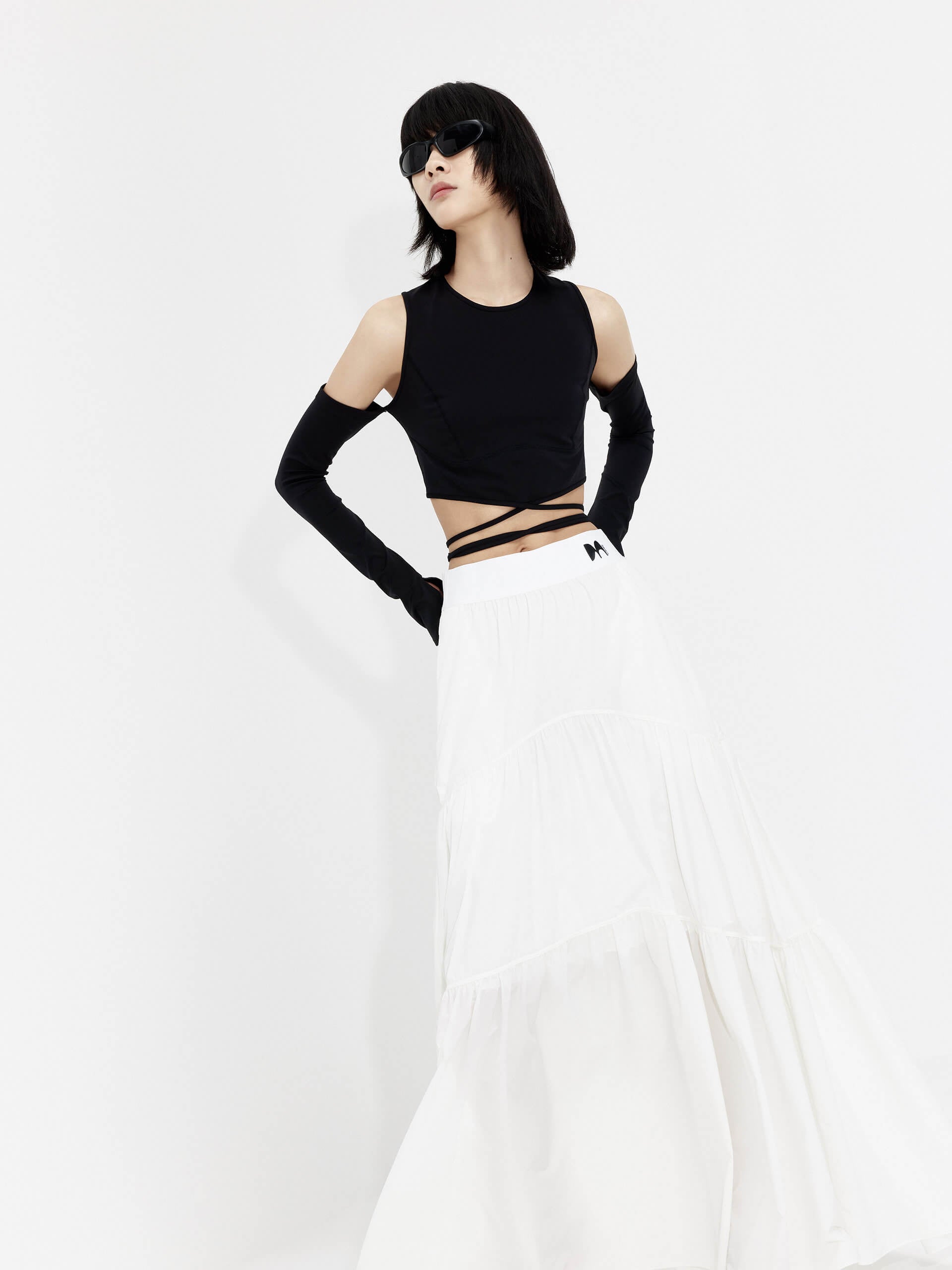 MO&Co. Women's Flowy Prairie Maxi Skirt in White for Summer Day features double side pockets, cool-touch fabric, an elasticized waistband, and gathered seam details for a perfect fit.