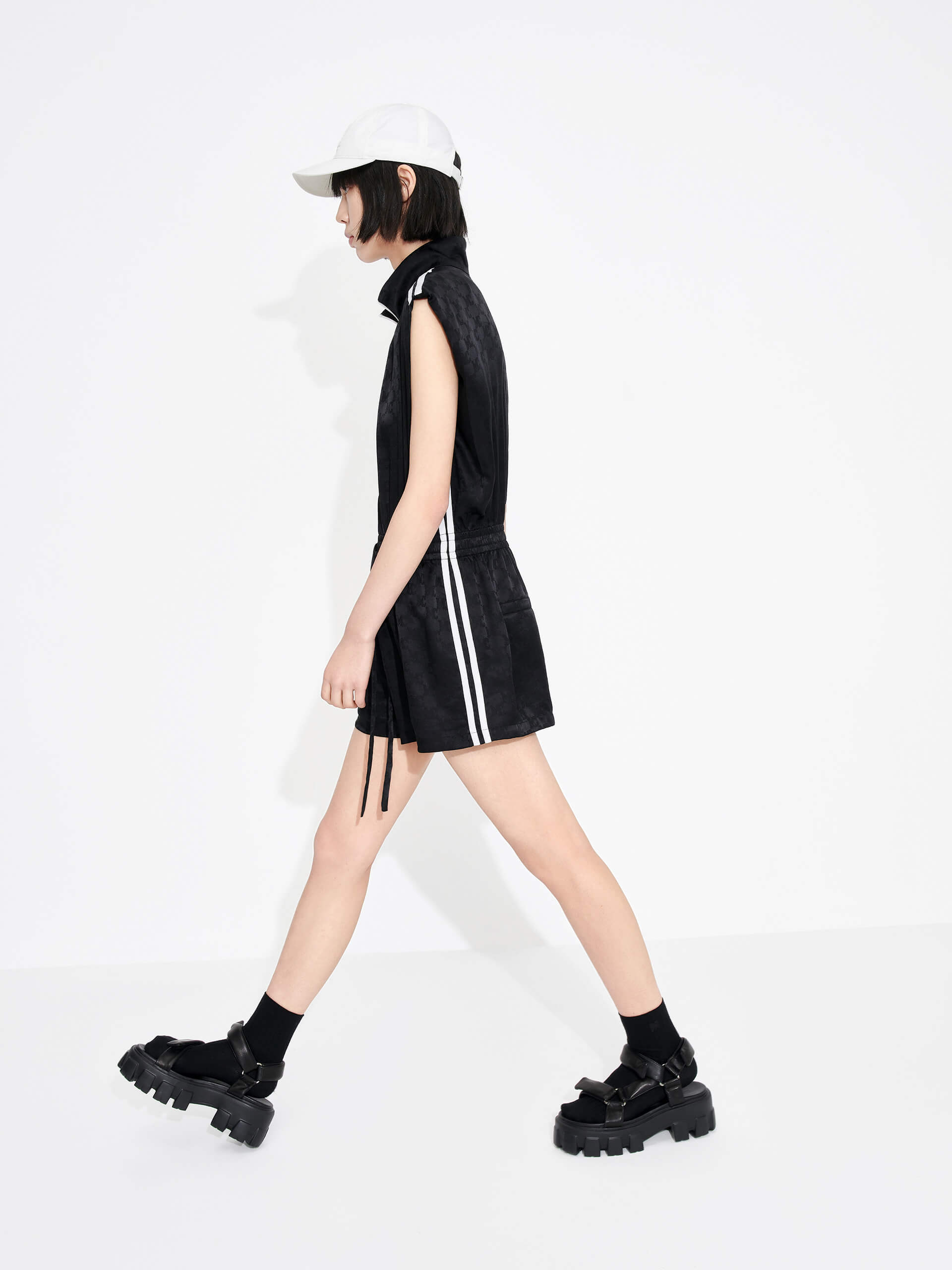 MO&Co. Women's Silk Blend Monogram Jacquard Sleeveless Playsuit in Black with drawstring waistline and a zipper along the front