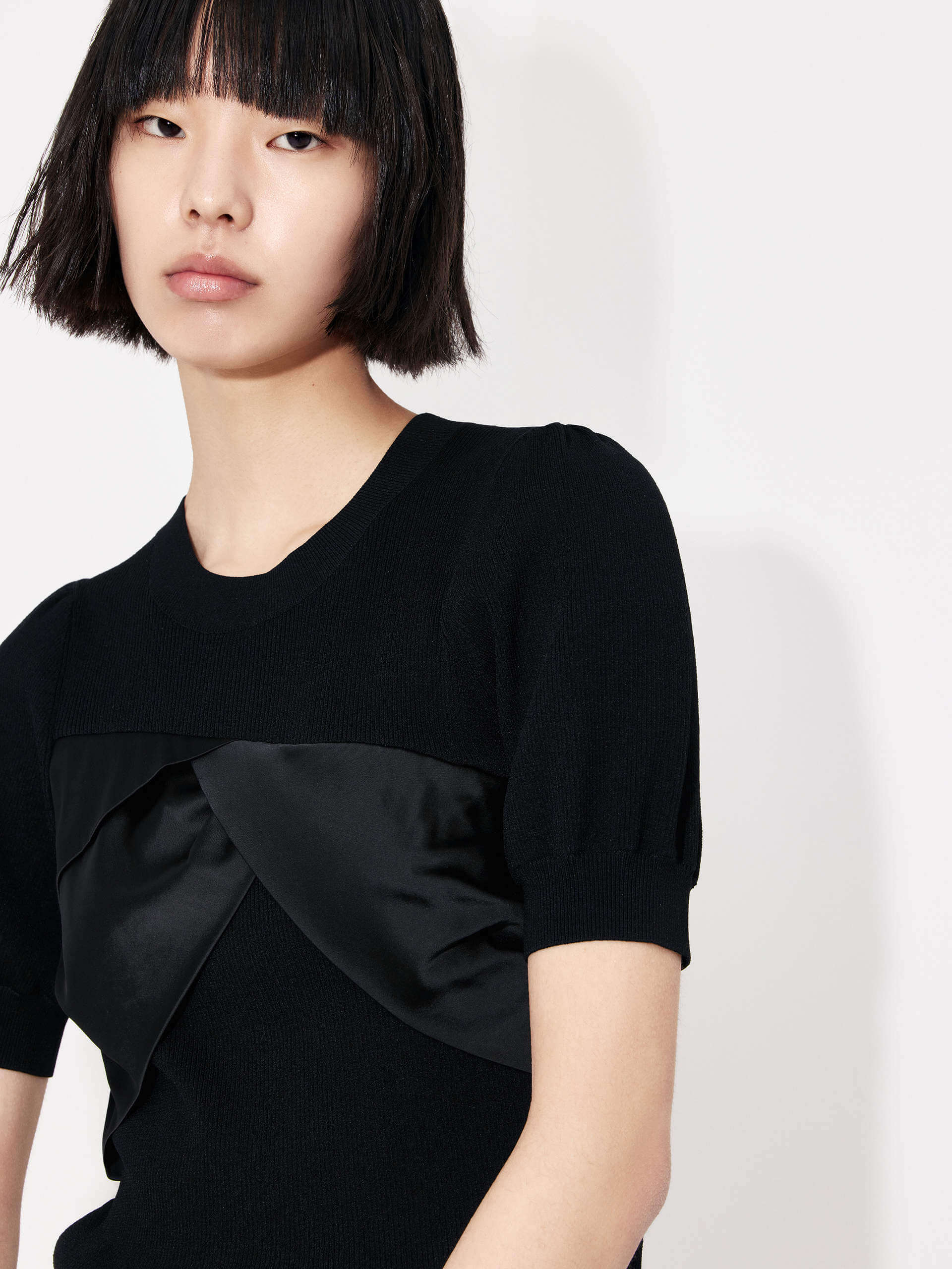 MO&Co. Women's Patch Detail Ribbed Top in Black with round neckline for casual looks and night out.