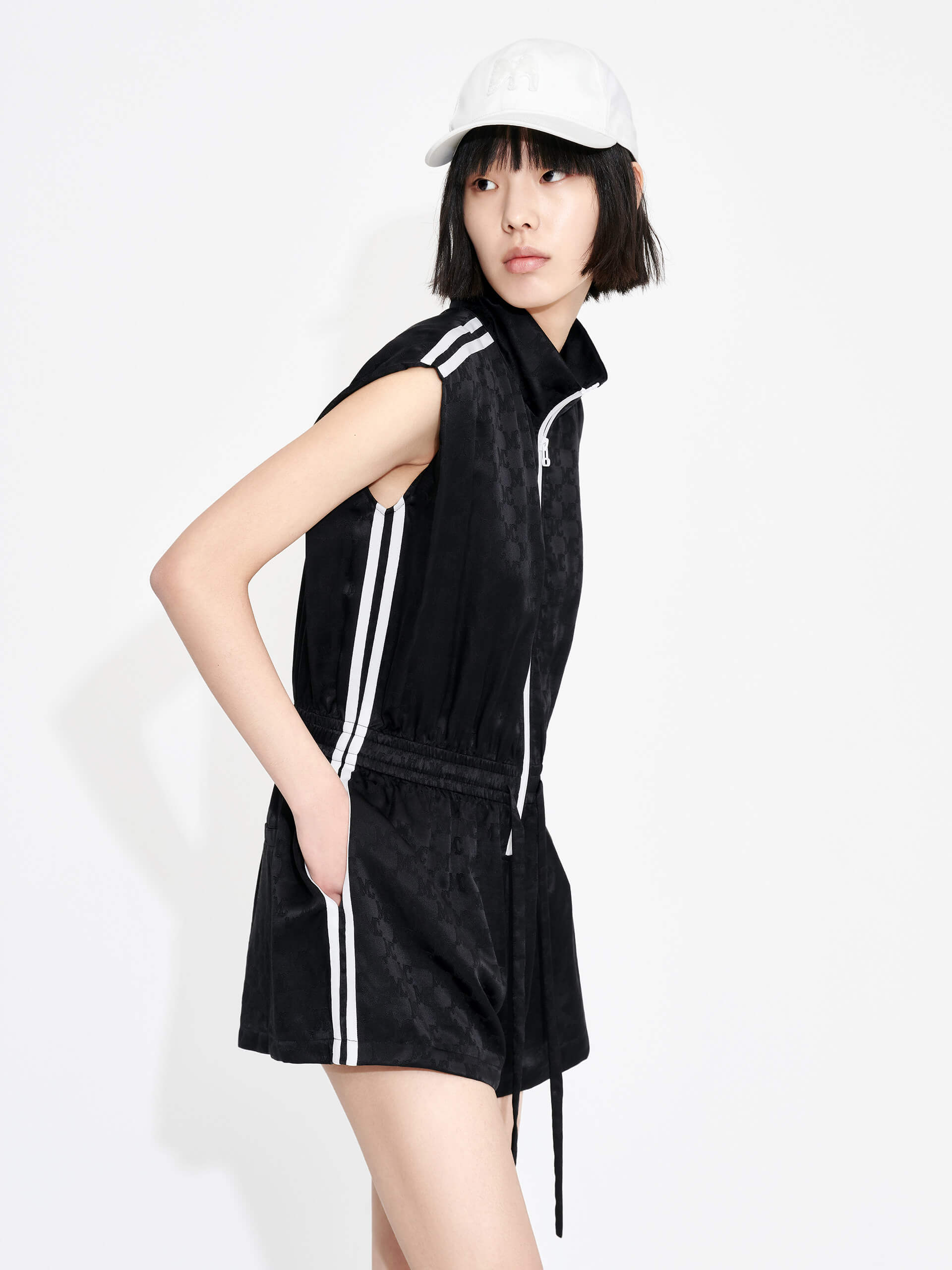 MO&Co. Women's Silk Blend Monogram Jacquard Sleeveless Playsuit in Black with drawstring waistline and a zipper along the front