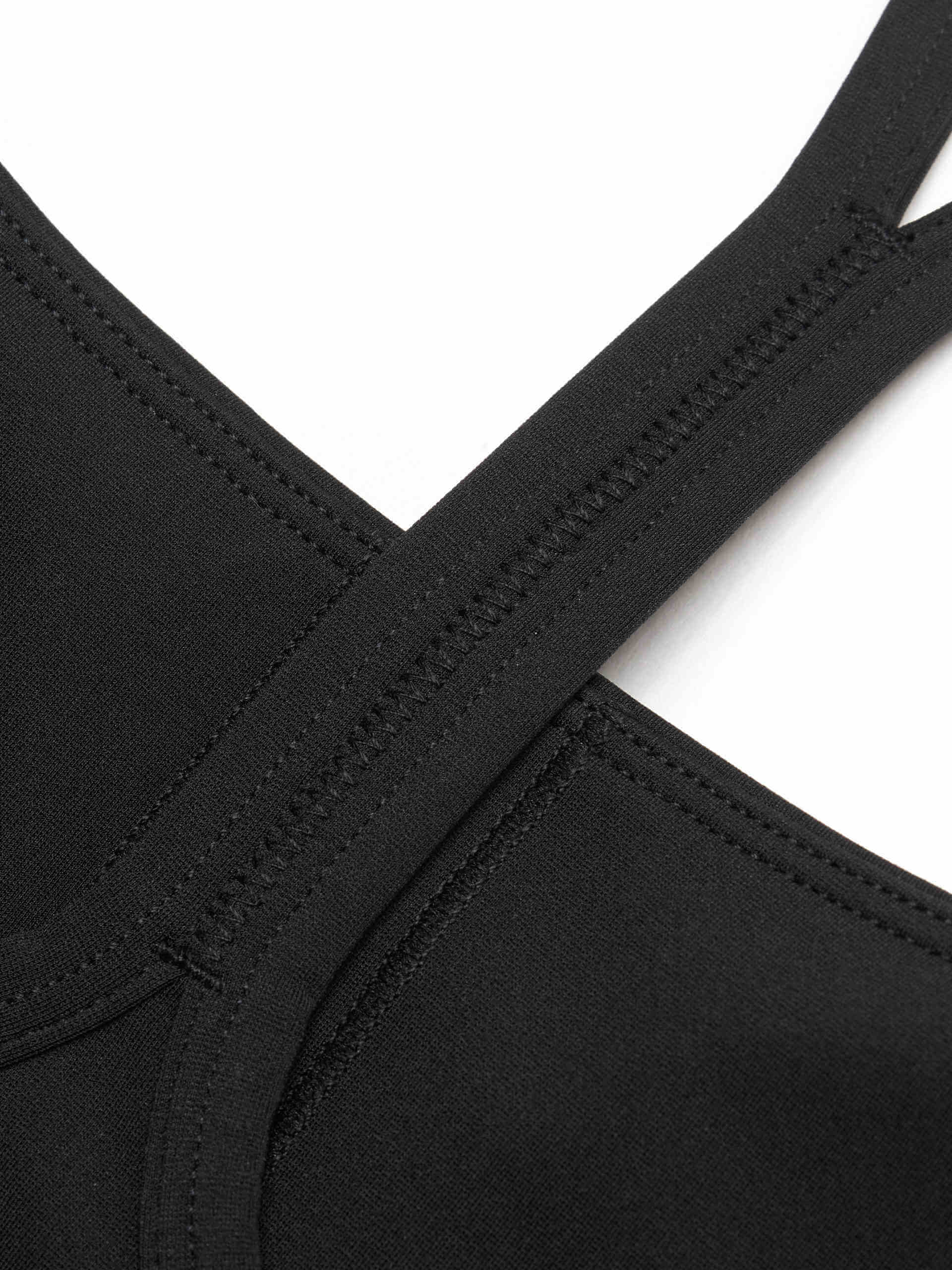 MO&Co. Women's Cropped Sports Bra in Black offers versatile style ideal for any activity. Its scoop neck, racerback, and elasticized hem provide ultimate comfort. Plus, it features UPF 40+ sun protection. Crafted with cool touch fabric and equipped with non-adjustable thin straps and removable cups.
