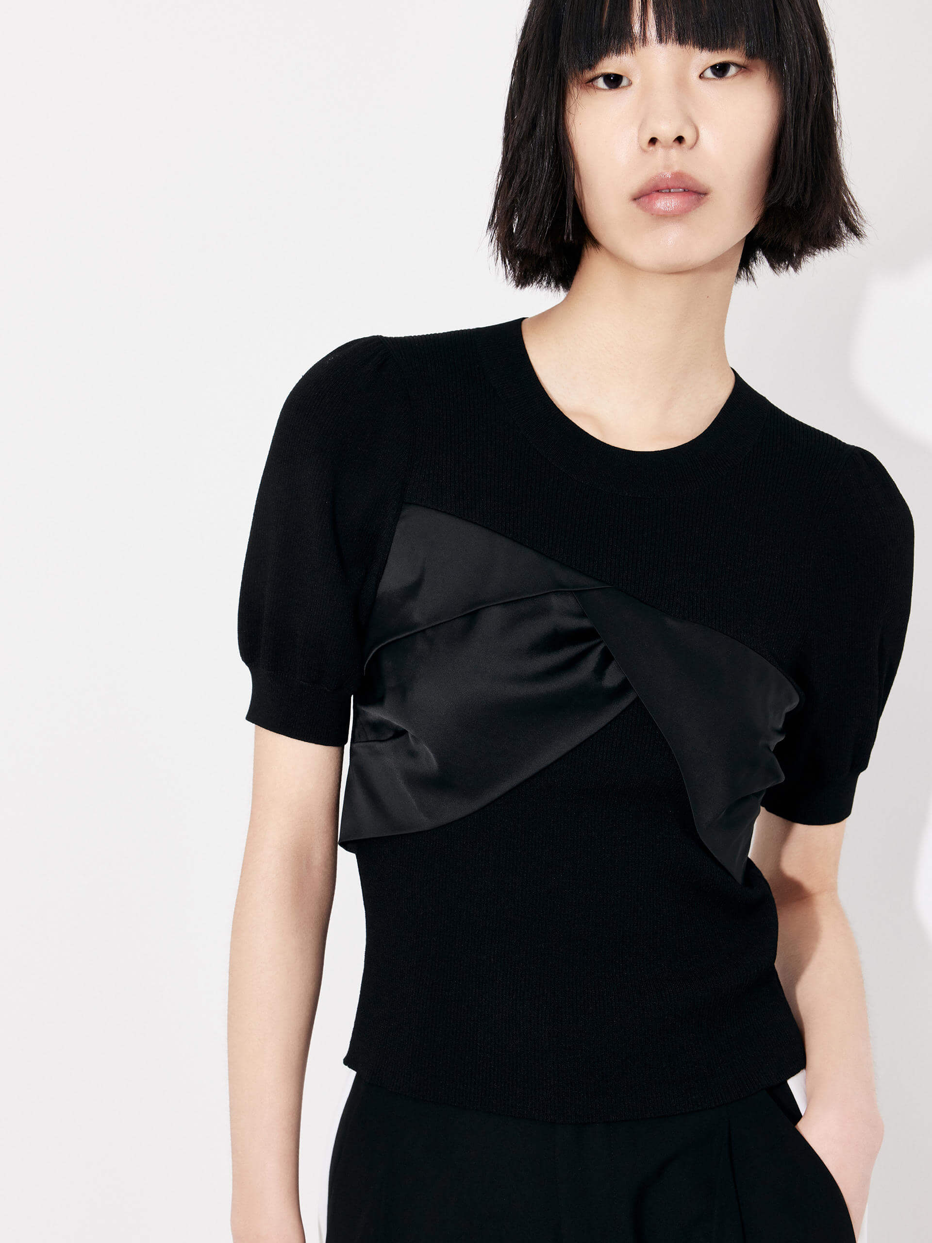 MO&Co. Women's Patch Detail Ribbed Top in Black with round neckline for casual looks and night out.