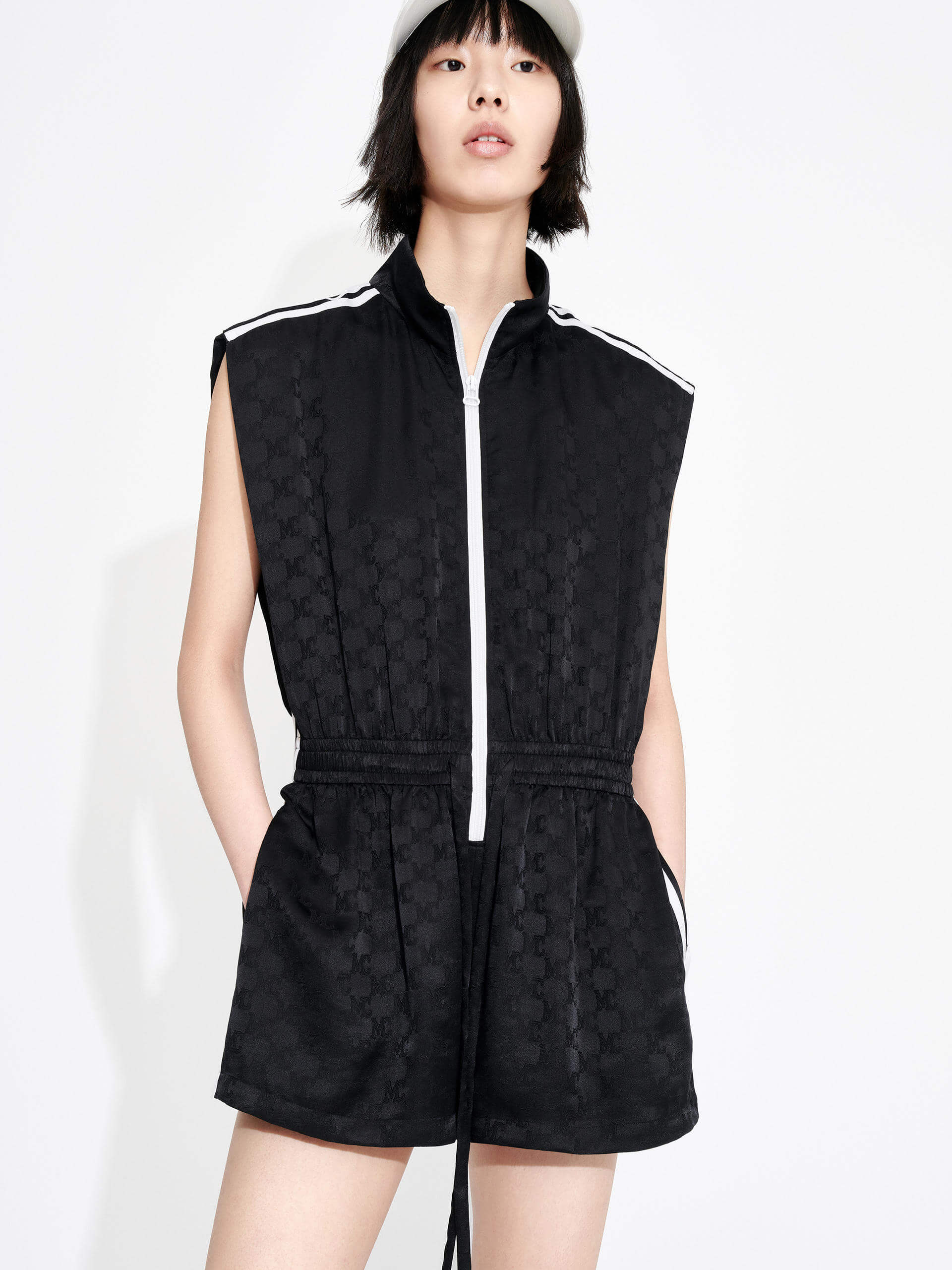 MO&Co. Women's Silk Blend Monogram Jacquard Sleeveless Playsuit in Black with drawstring waistline and a zipper along the front