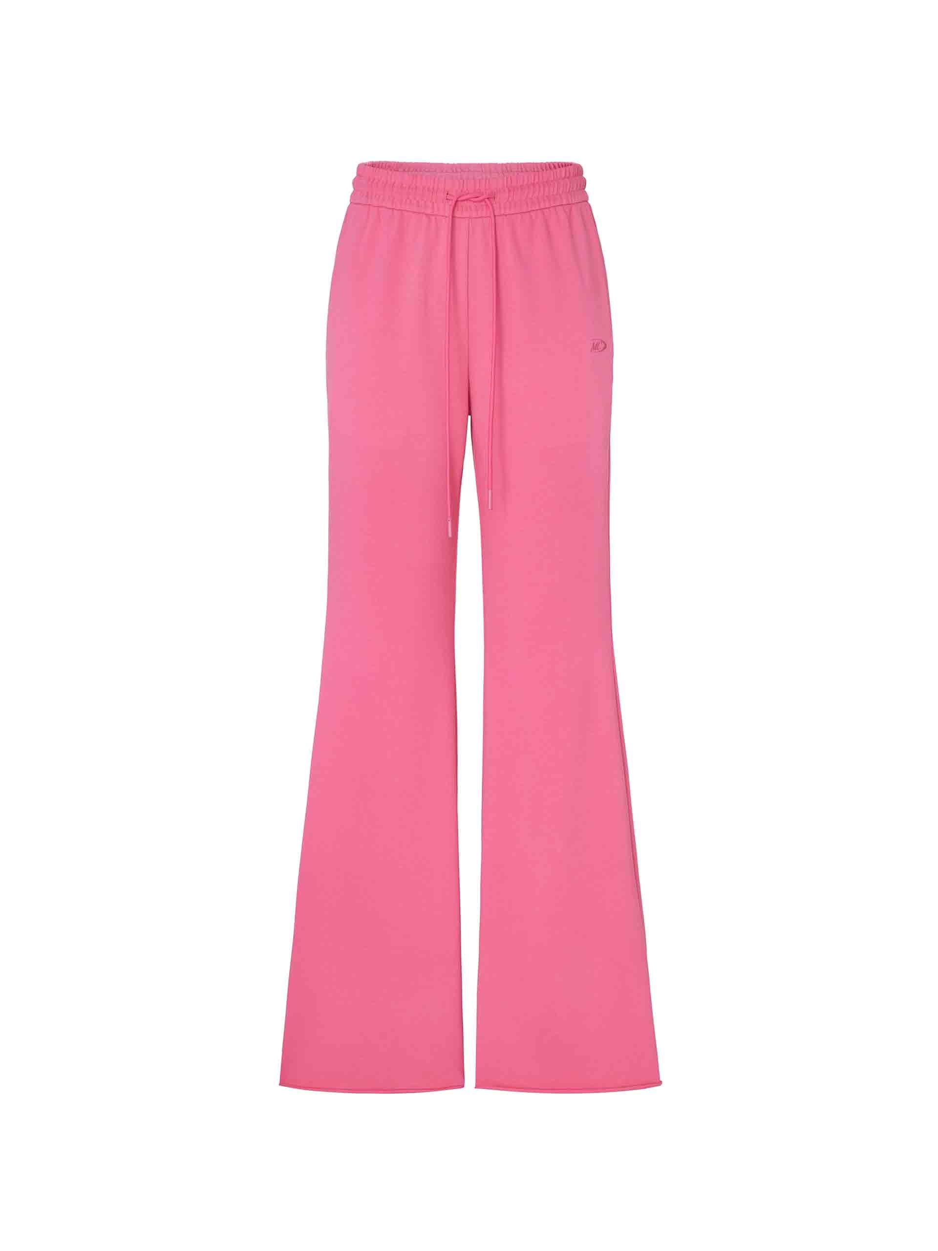 MO&Co.'s Drawstring Waist Causal Flared Sweatpants in Hot Pink. Crafted from soft cotton, these trousers feature a relaxed fit with drawstrings and elastic waistband for comfort. They also come with flared legs and double side pockets with MC embroidery details.