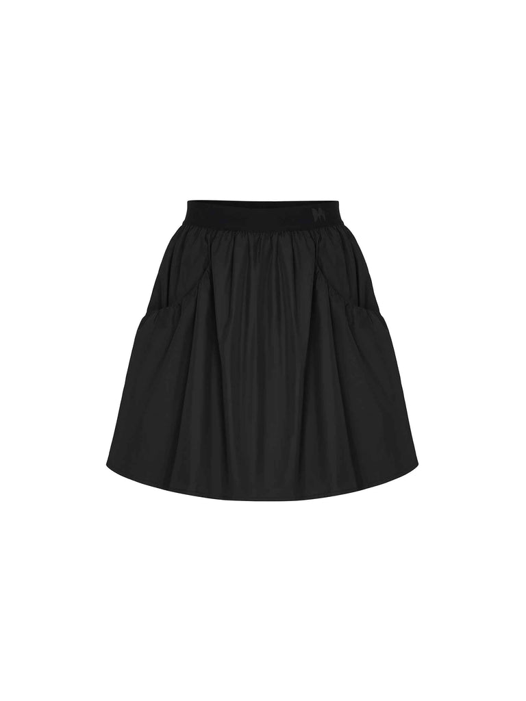 MO&Co. Women's Elastic Waist Pleated Mini Full Skirt in Black. Crafted with a high-waisted fit, this mini skirt flatters any figure and its stiff and smooth fabric ensures all-day chicness. Additional features include elastic waistband in woven M pattern design and double-side pocket.