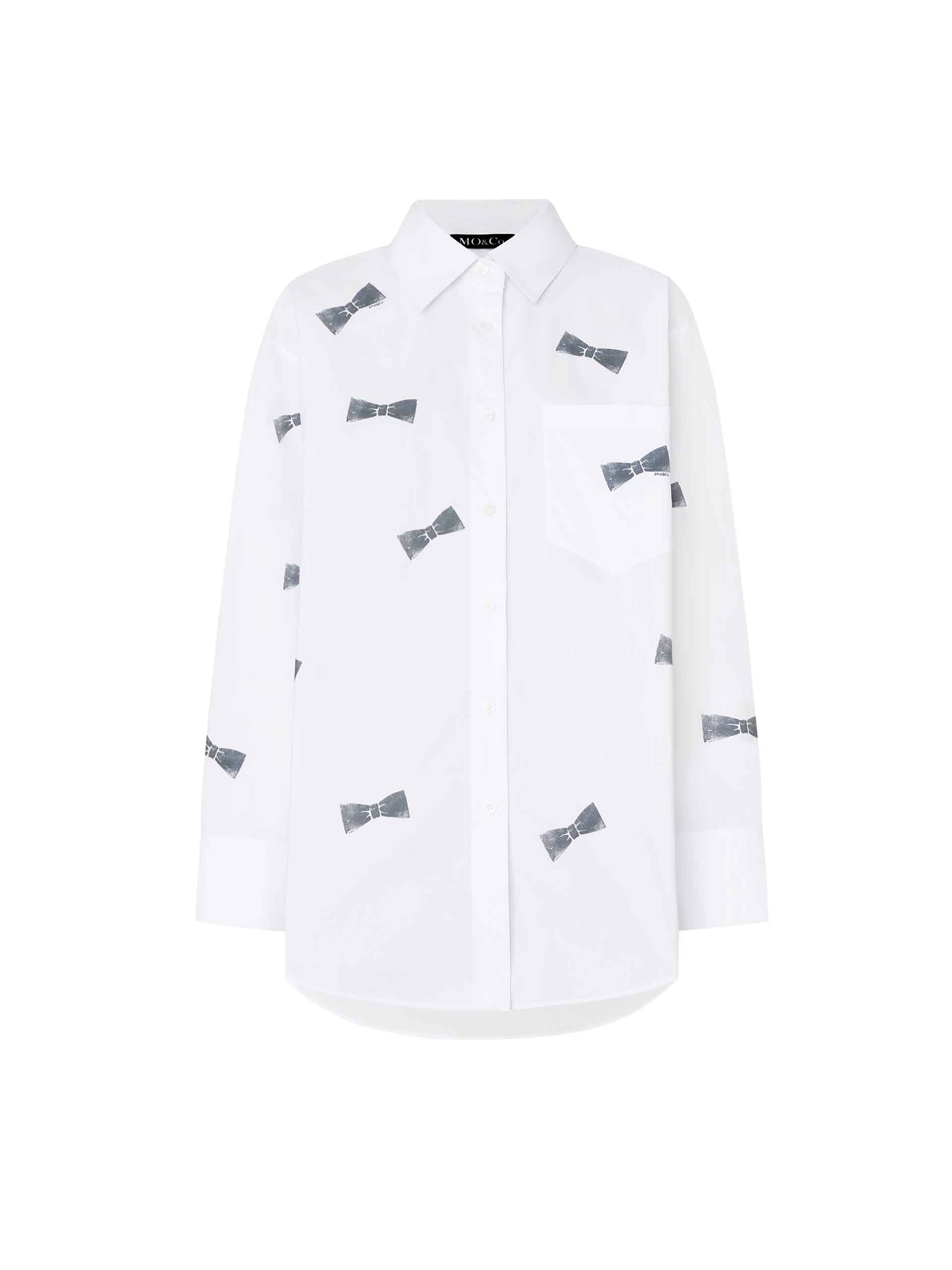 MO&Co. Women's Bowknot Pattern Cotton Shirt in White, with its all-over bowknot print design, comfortable cotton material and loose fit.