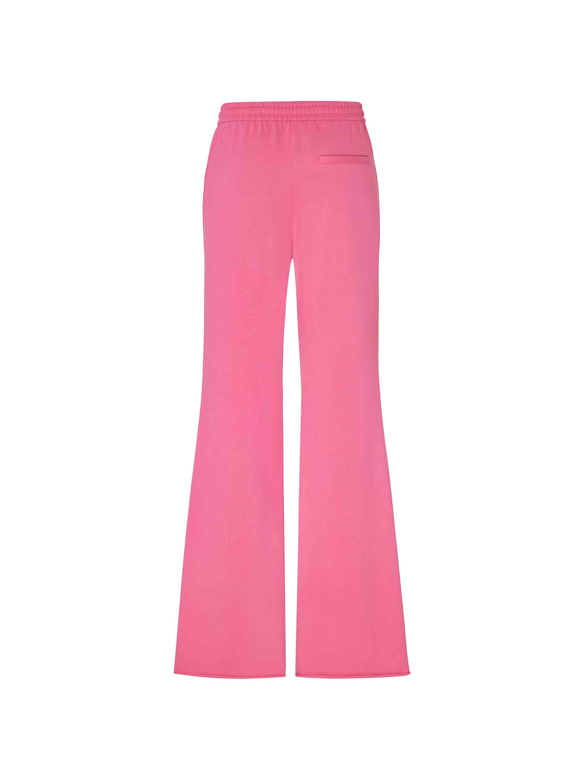 MO&Co.'s Drawstring Waist Causal Flared Sweatpants in Hot Pink. Crafted from soft cotton, these trousers feature a relaxed fit with drawstrings and elastic waistband for comfort. They also come with flared legs and double side pockets with MC embroidery details.