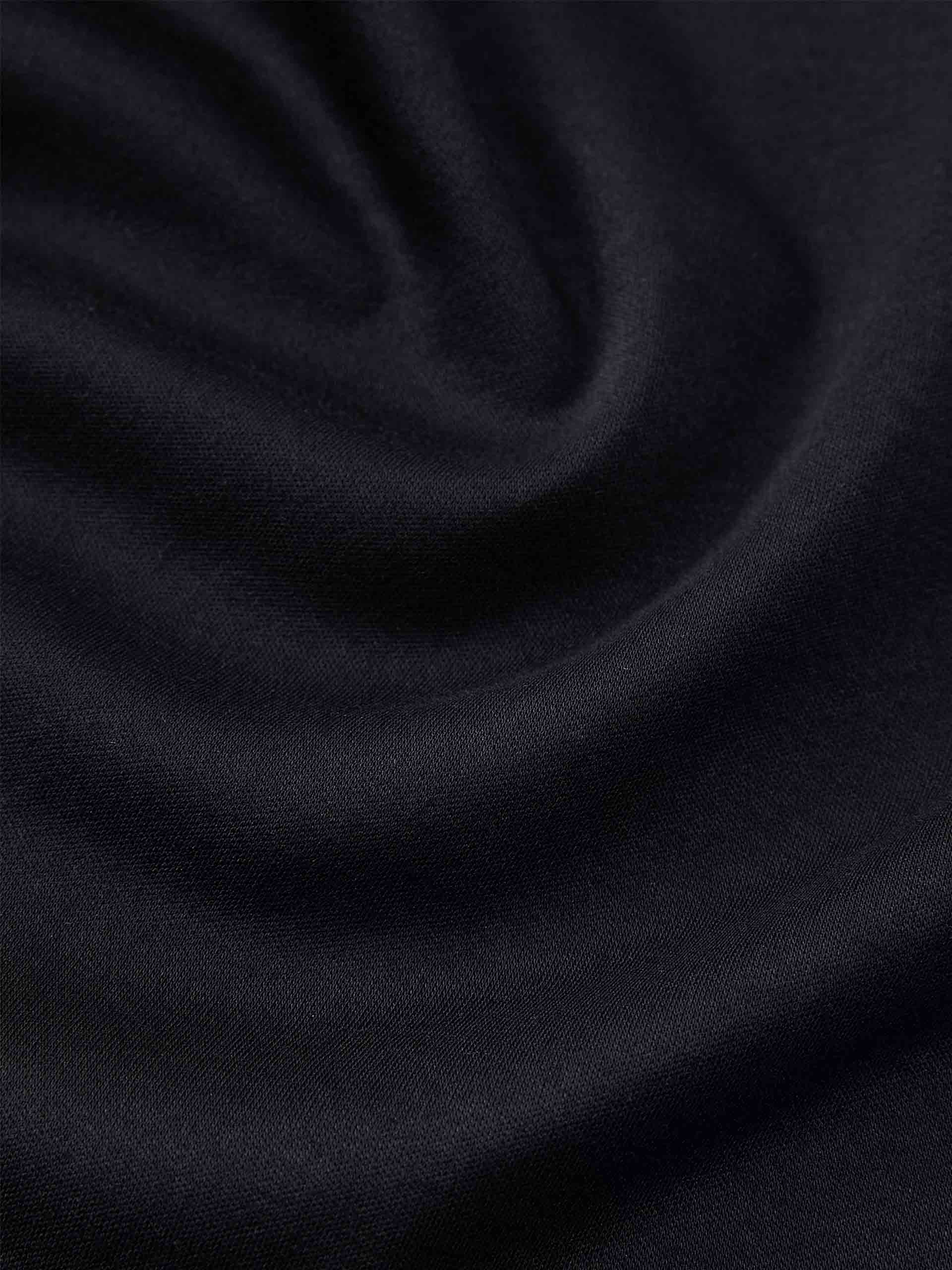 MO&Co. Women's Stand Collar Pleated Mini Dress in Black showcases an accentuated waistline, classic mandarin collar, and a unique slanted placket with metal button details for a perfect blend of classic and modern.