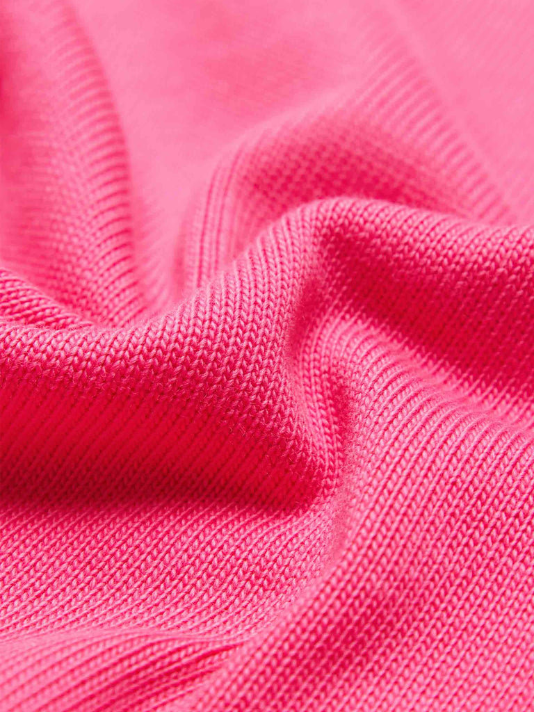 MO&Co.'s Drawstring Waist Causal Flared Sweatpants in Hot Pink. Crafted from soft cotton, these trousers feature a relaxed fit with drawstrings and elastic waistband for comfort. They also come with flared legs and double side pockets with MC embroidery details.