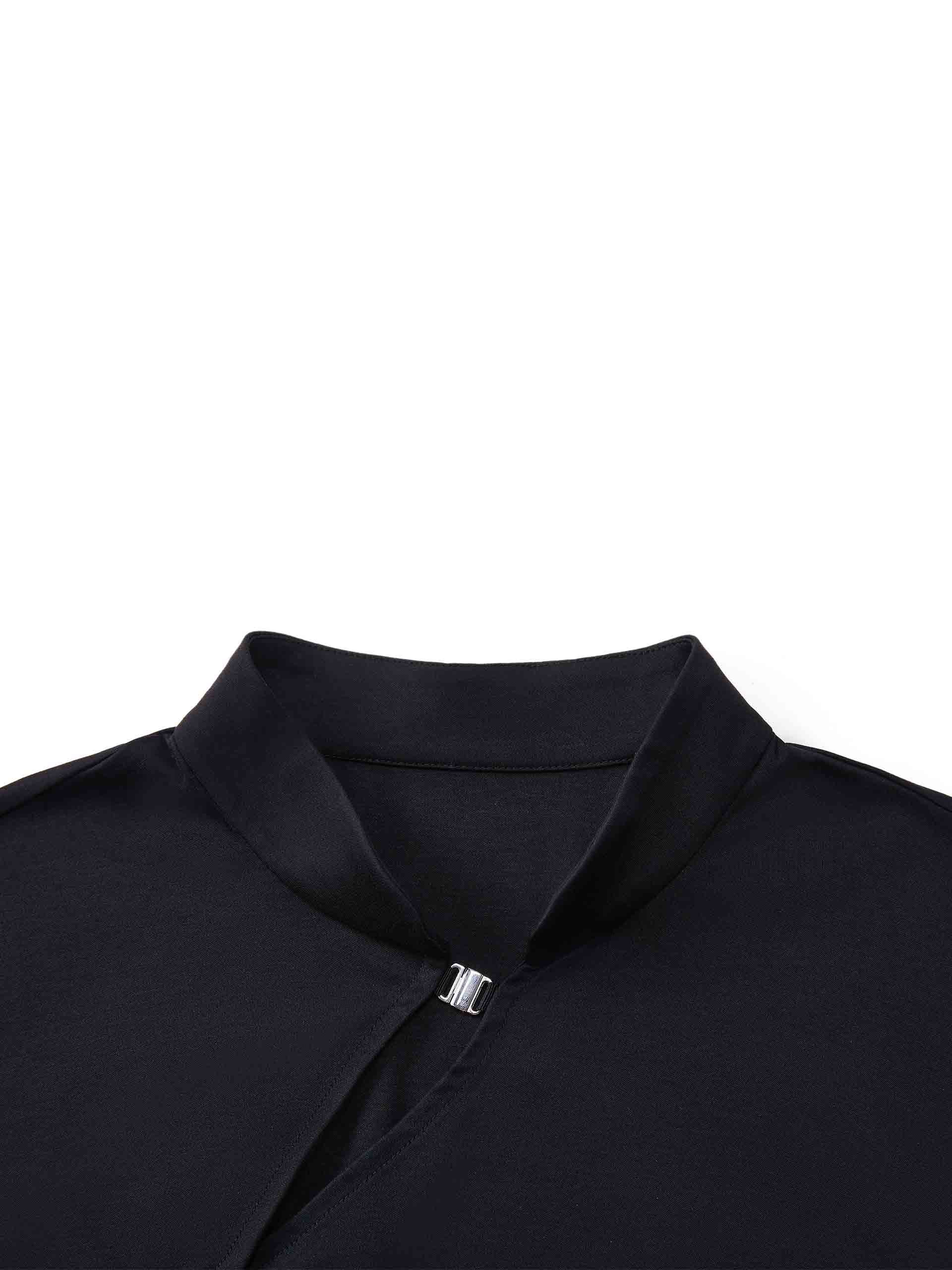 MO&Co. Women's Stand Collar Pleated Mini Dress in Black showcases an accentuated waistline, classic mandarin collar, and a unique slanted placket with metal button details for a perfect blend of classic and modern.