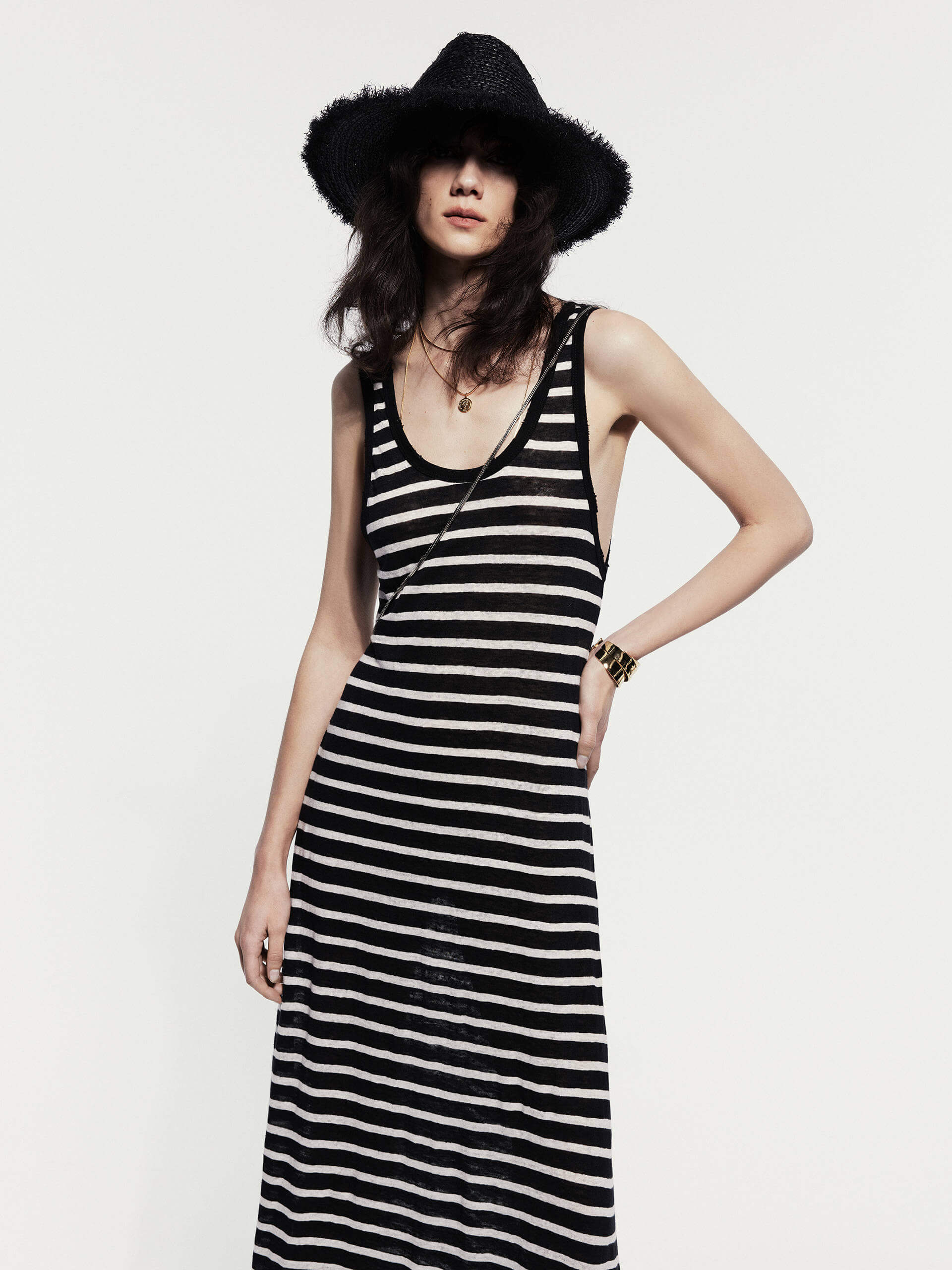 MO&Co. Noir Women's Striped Linen Maxi Tank Dress. Made from breathable linen, this dress features a U-shaped neckline with distressed details for a casual-chic vibe.