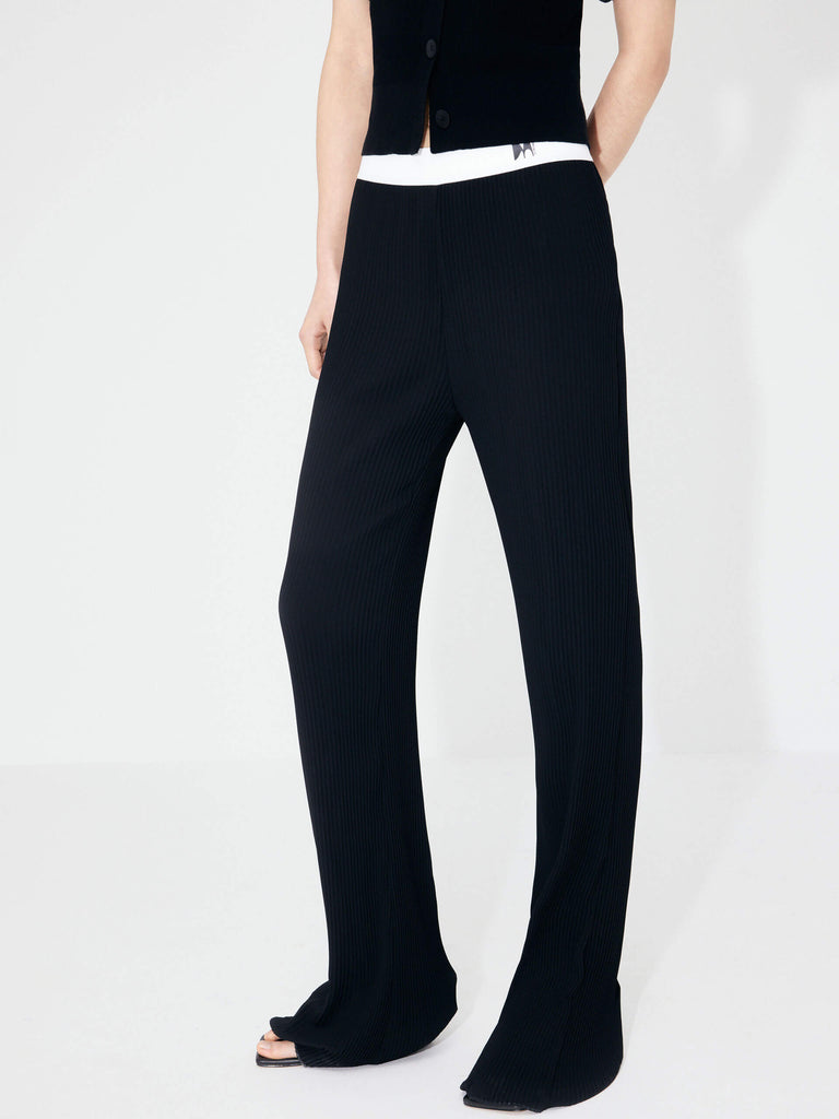 MO&Co's Structured Contrast Detail Pants in Black. Featuring a contrasting elastic waistband and structured texture fabric, these pants are sure to elevate any look.