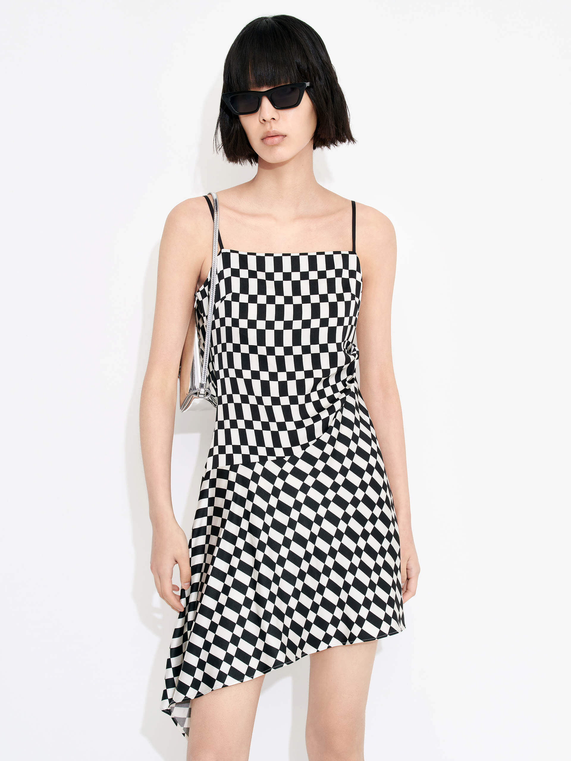 MO&Co. Women's Gathered Detail Asymmetric Plaid Mini Dress in Black and White features a straight neckline, mini length & asymmetric hem designs for a flattering fit. Pleated side sweeps add texture for an interesting look. Perfect for cocktail and evening out.