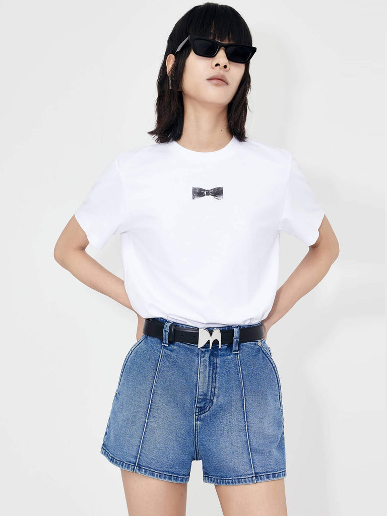 MO&Co. Women's Bowknot Pattern Cotton Blend Lightweight T-Shirt in White features a crew neckline regular fit design and a stylish front bowknot pattern print.