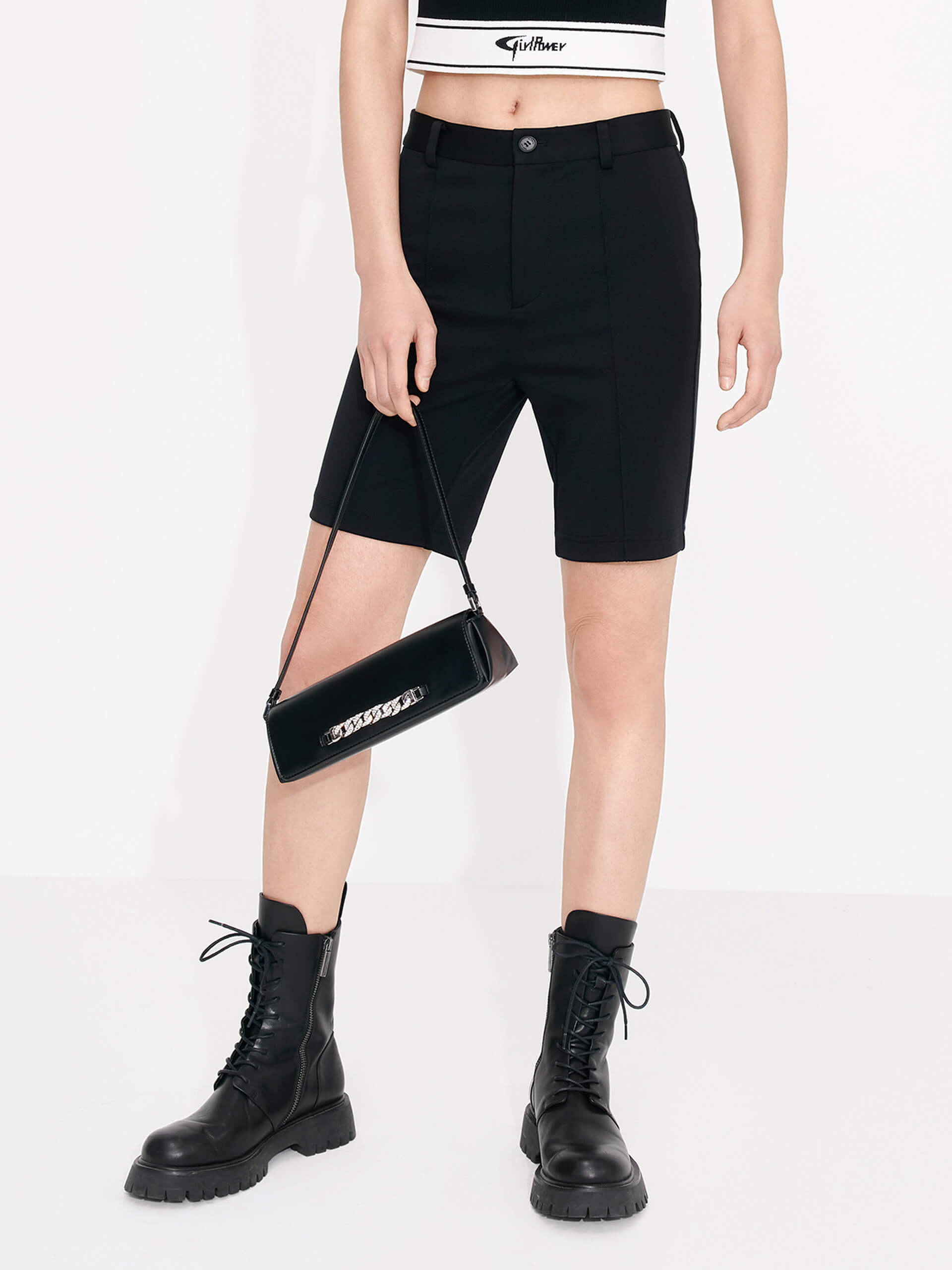 Discover our tight fit Mid-rise Skinny leg Shorts in Black, including belt loops, a zipper and button closure, and a back mock pocket.