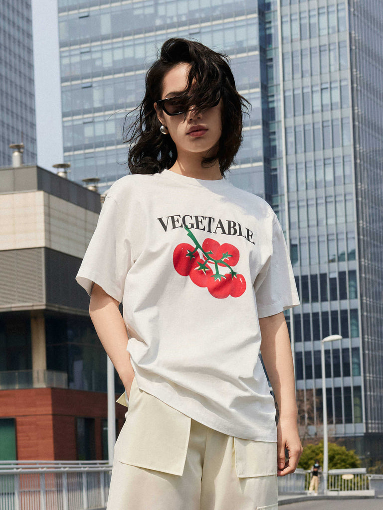 MO&Co. Women's Vegetable Print Cotton White T-Shirt. Crafted from breathable, anti-bacterial cotton, this regular fit garment is designed with a dropped shoulder and tomato print that will keep you comfortable and fashionable all day.