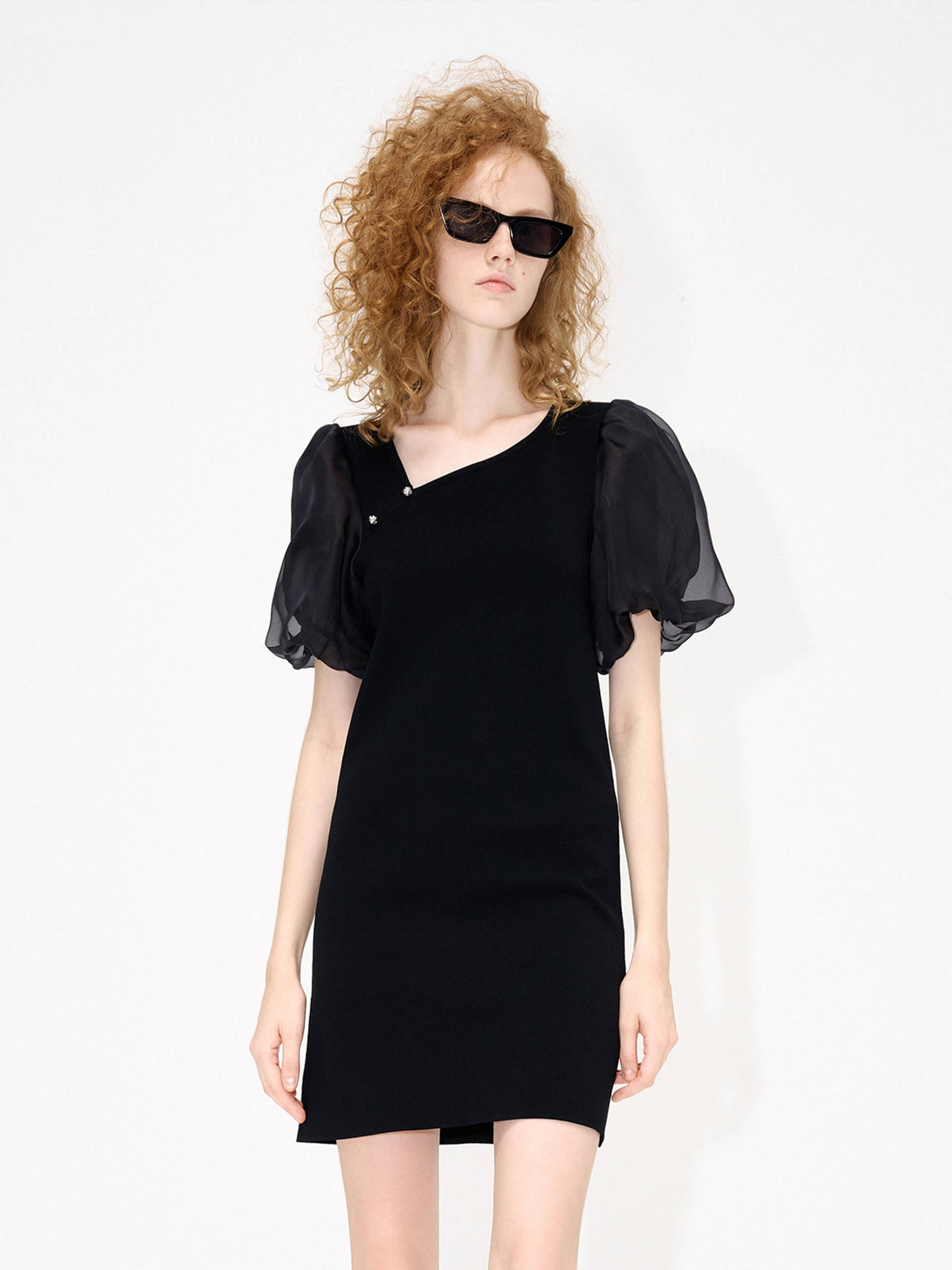 MO&Co. Women's Asymmetric Collar Mini Dress in Black featured with sheer puff sleeves and ssymmetric collar with metallic buckle details