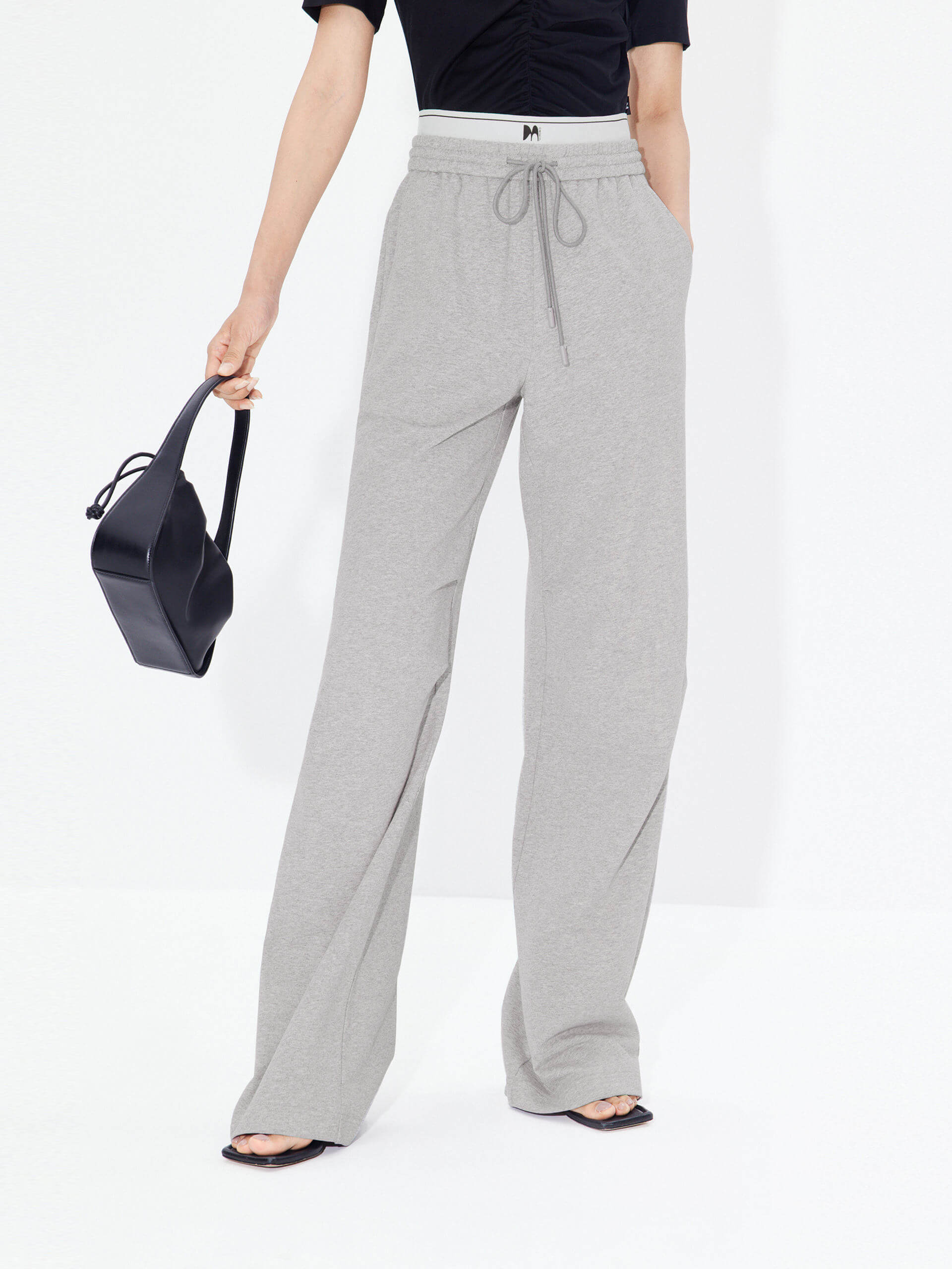 MO&Co. Women's Double Waistband Wide-leg Casual Trousers in Cotton - Grey. Made from breathable cotton fabric, these sweatpants offer a relaxed, stylish fit complete with wide legs & slant pockets. Contrast double waistbands & letter details give them added style.