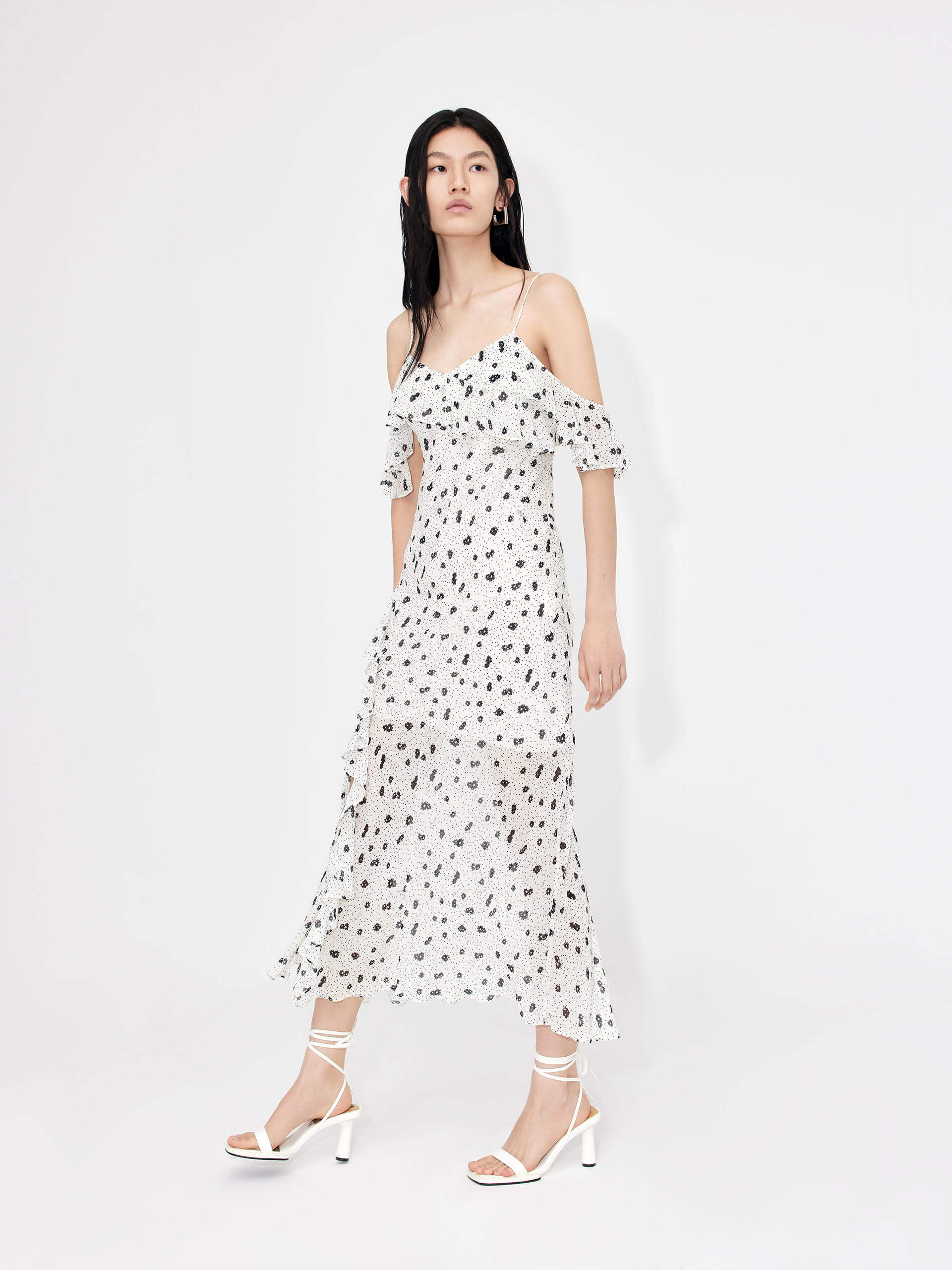 MO&Co. Women's Polka Dot Tulle Slip Dress in White features eye-catching frill details, floral/polka-dot print, adjustable straps and a front slit combine to make a stand-out look for your wardrobe.