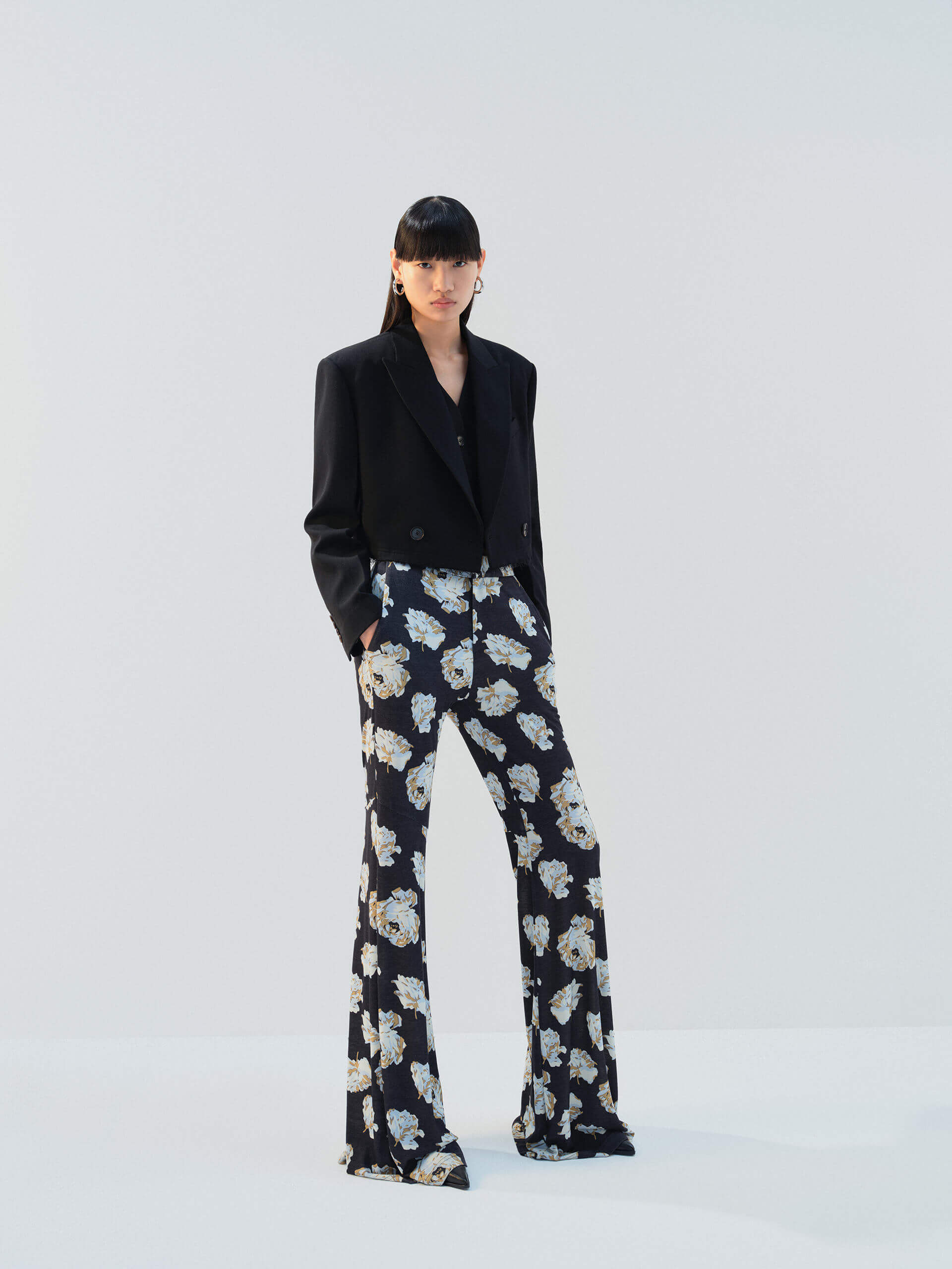 MO&Co. Noir Women's Floral Printed Full Length Flared Pants with a high waist, flared leg, comfy stretchy material, slanted pockets, and hook-and-bar closure, these pants offer both style and functionality.