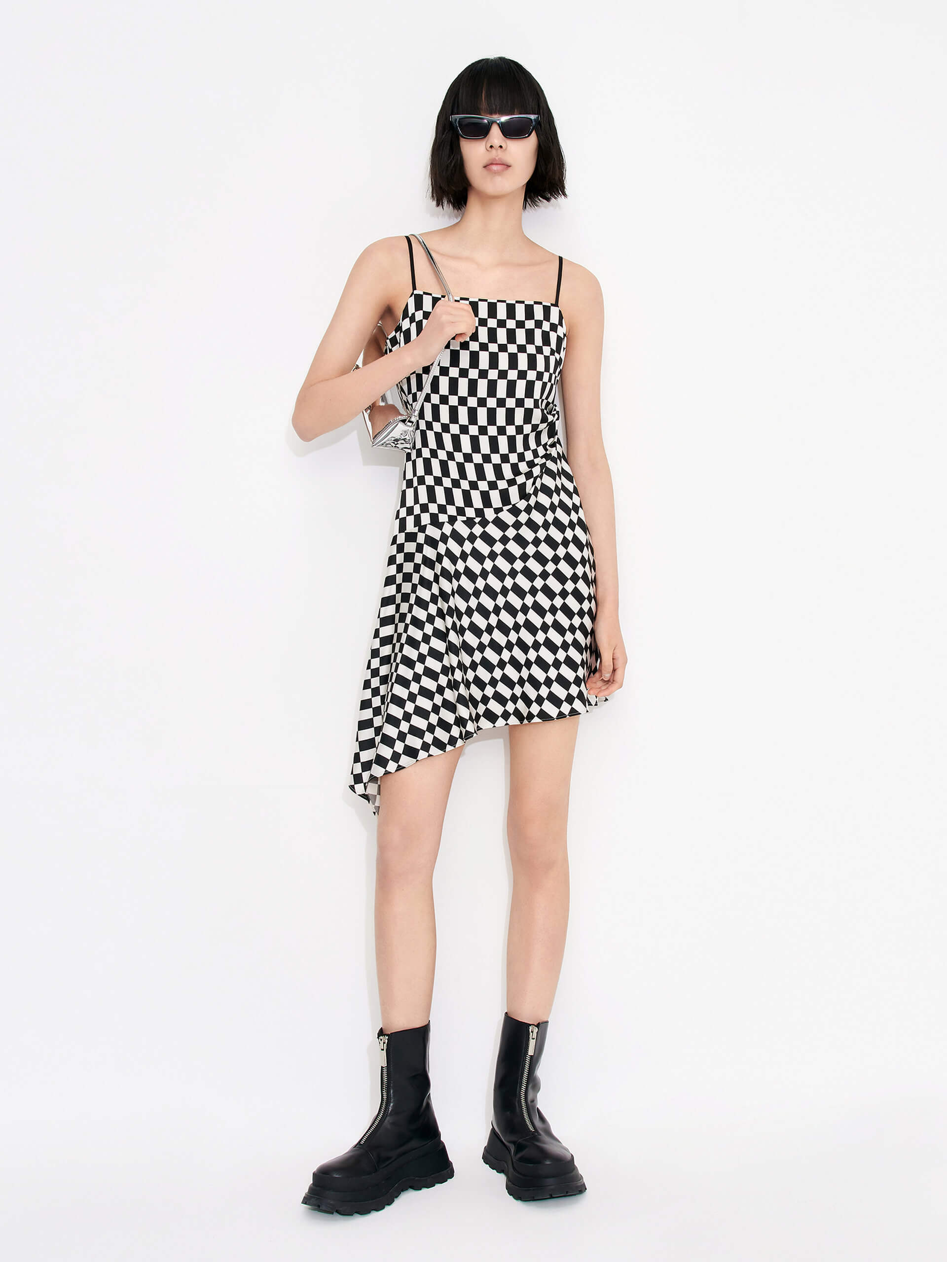 MO&Co. Women's Gathered Detail Asymmetric Plaid Mini Dress in Black and White features a straight neckline, mini length & asymmetric hem designs for a flattering fit. Pleated side sweeps add texture for an interesting look. Perfect for cocktail and evening out.